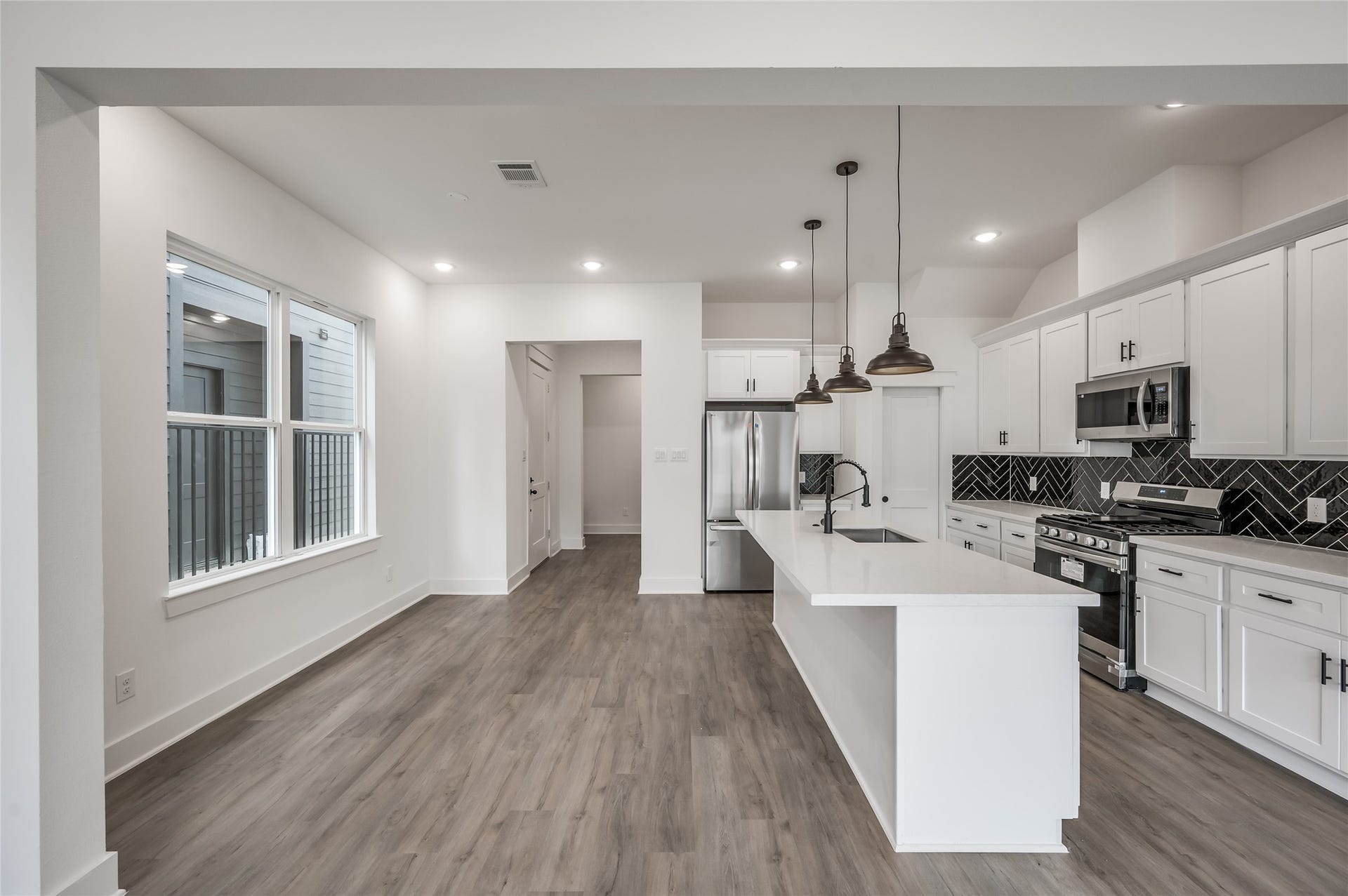 The kitchen opens right into the dining area, keeping the whole first floor connected and easy to entertain in