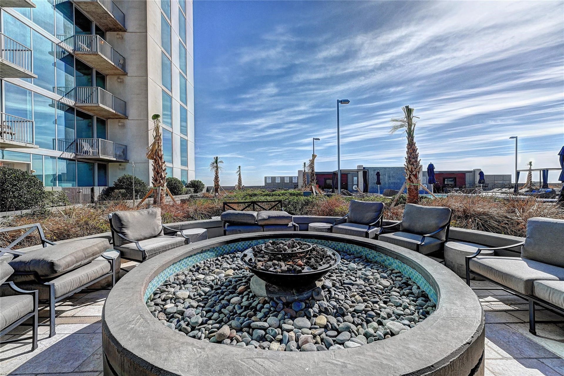 Large firepit  at the pool level for evening and cold weather enjoyment