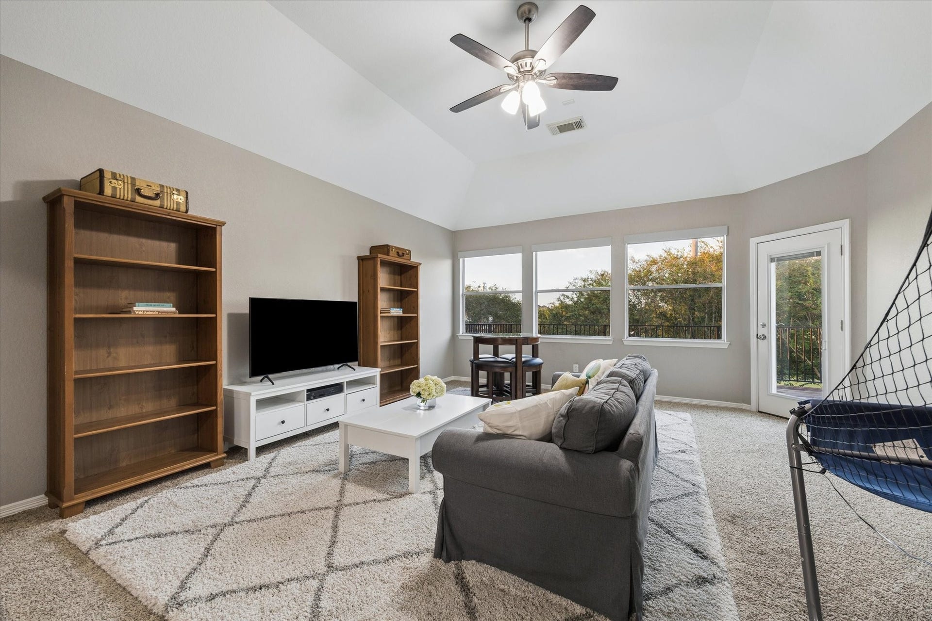 3523 Silvercreek Drive, Manvel, TX 77578 Second floor game room with views to balcony, ceiling fan with light