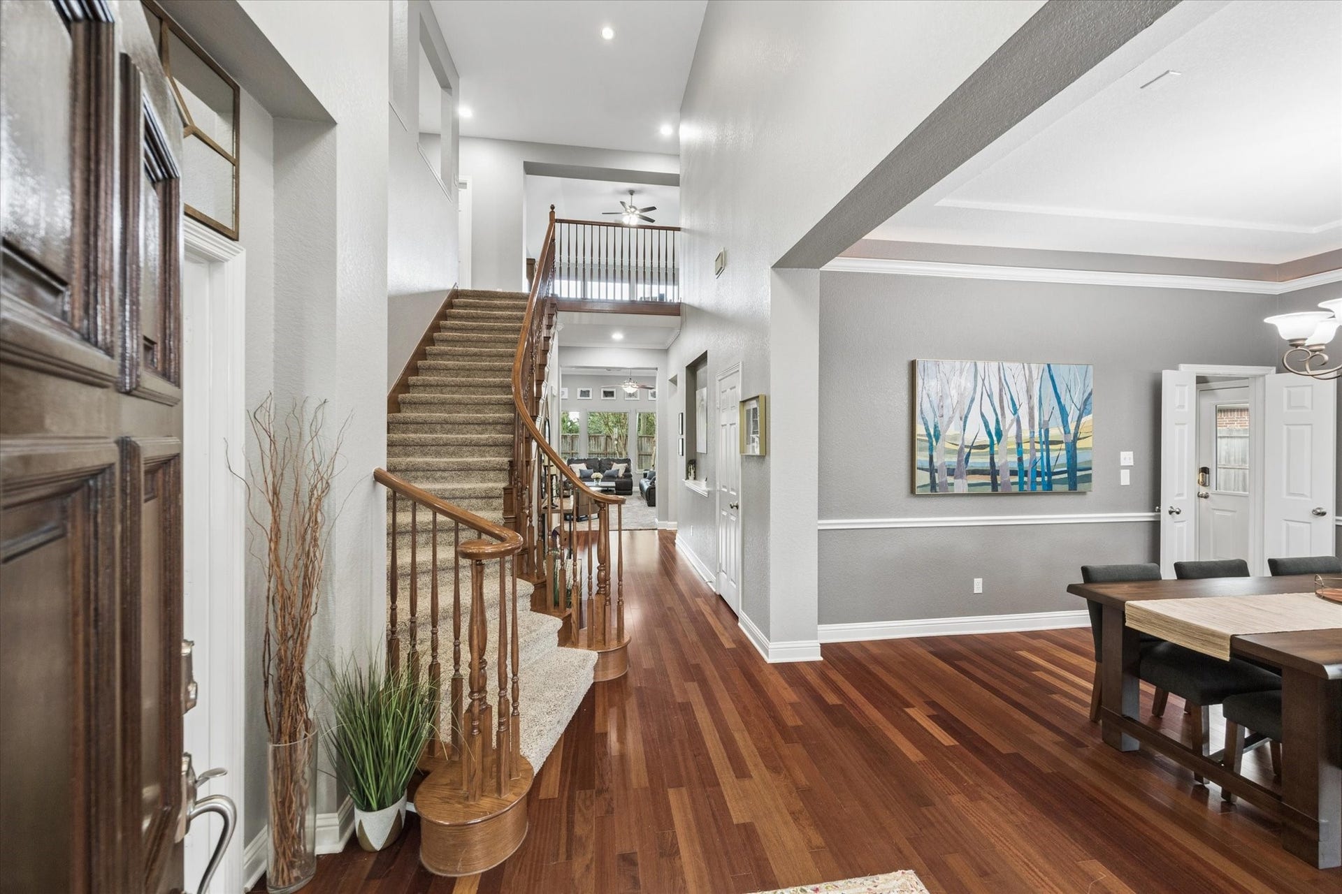 3523 Silvercreek Drive, Manvel, TX 77578 2 story entry with hardwood flooring, opens to dining and living room