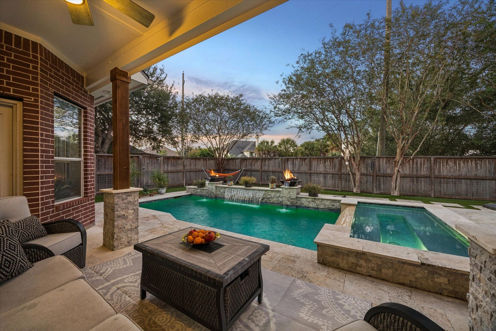 3523 Silvercreek Drive, Manvel, TX 77578 Resort style backyard with pool, spa, firepits, and water feature