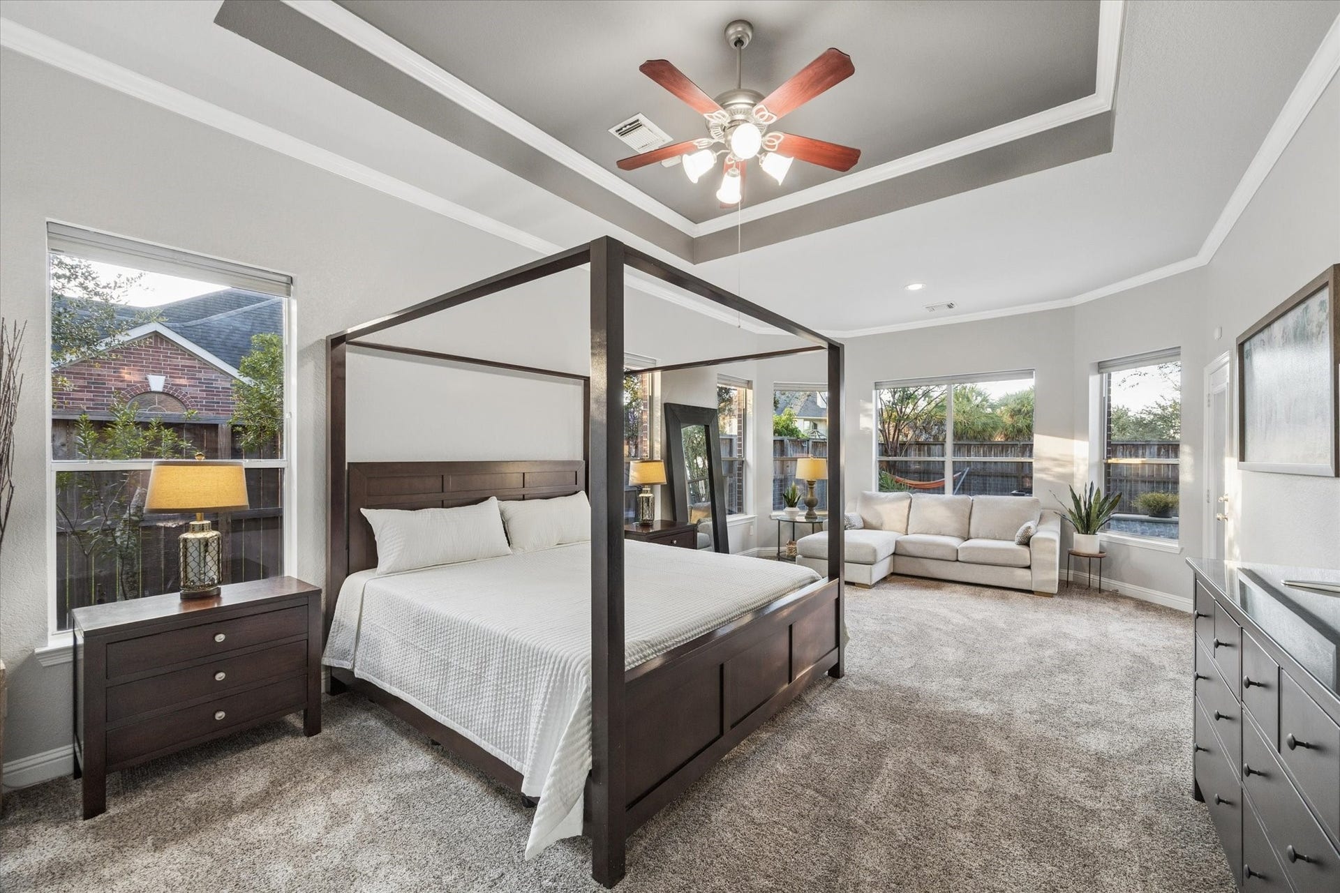 3523 Silvercreek Drive, Manvel, TX 77578 Primary bedroom suite offers newly replaced carpet, sitting area, tray ceiling, ceiling fan with light and access to pool and patio