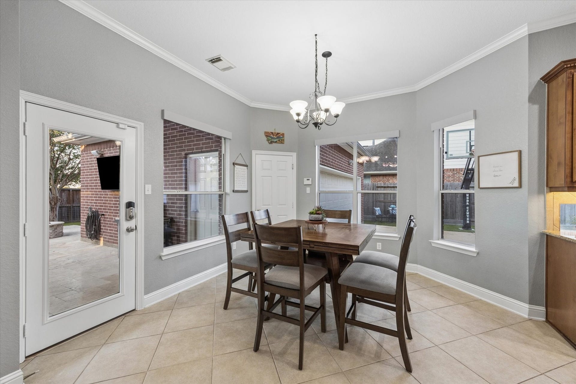 3523 Silvercreek Drive, Manvel, TX 77578 Breakfast room with view to motor court and access the back patio and garage