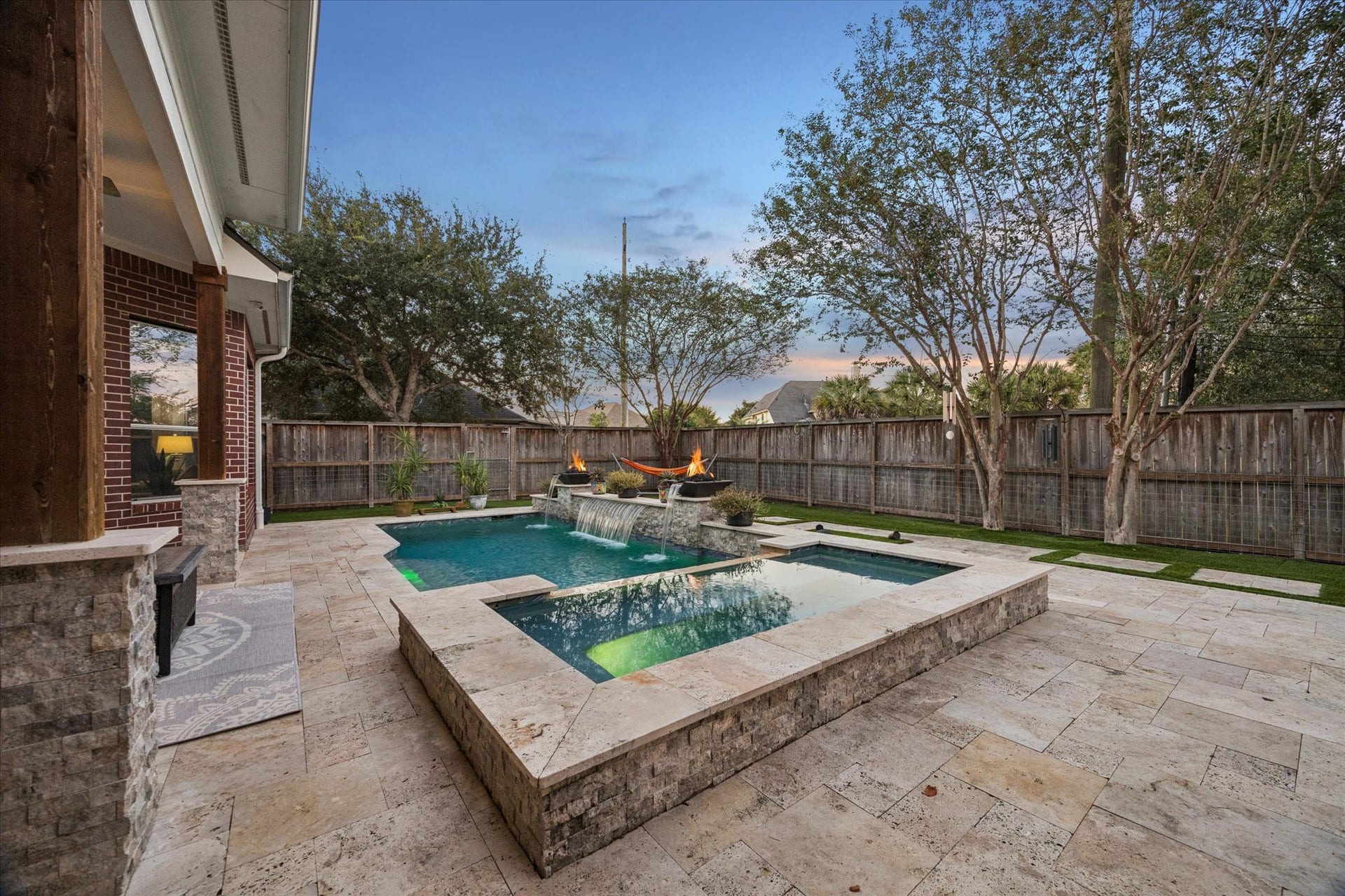 3523 Silvercreek Drive, Manvel, TX 77578 Pool lighting with firepits and water features add a relaxing feel to your backyard