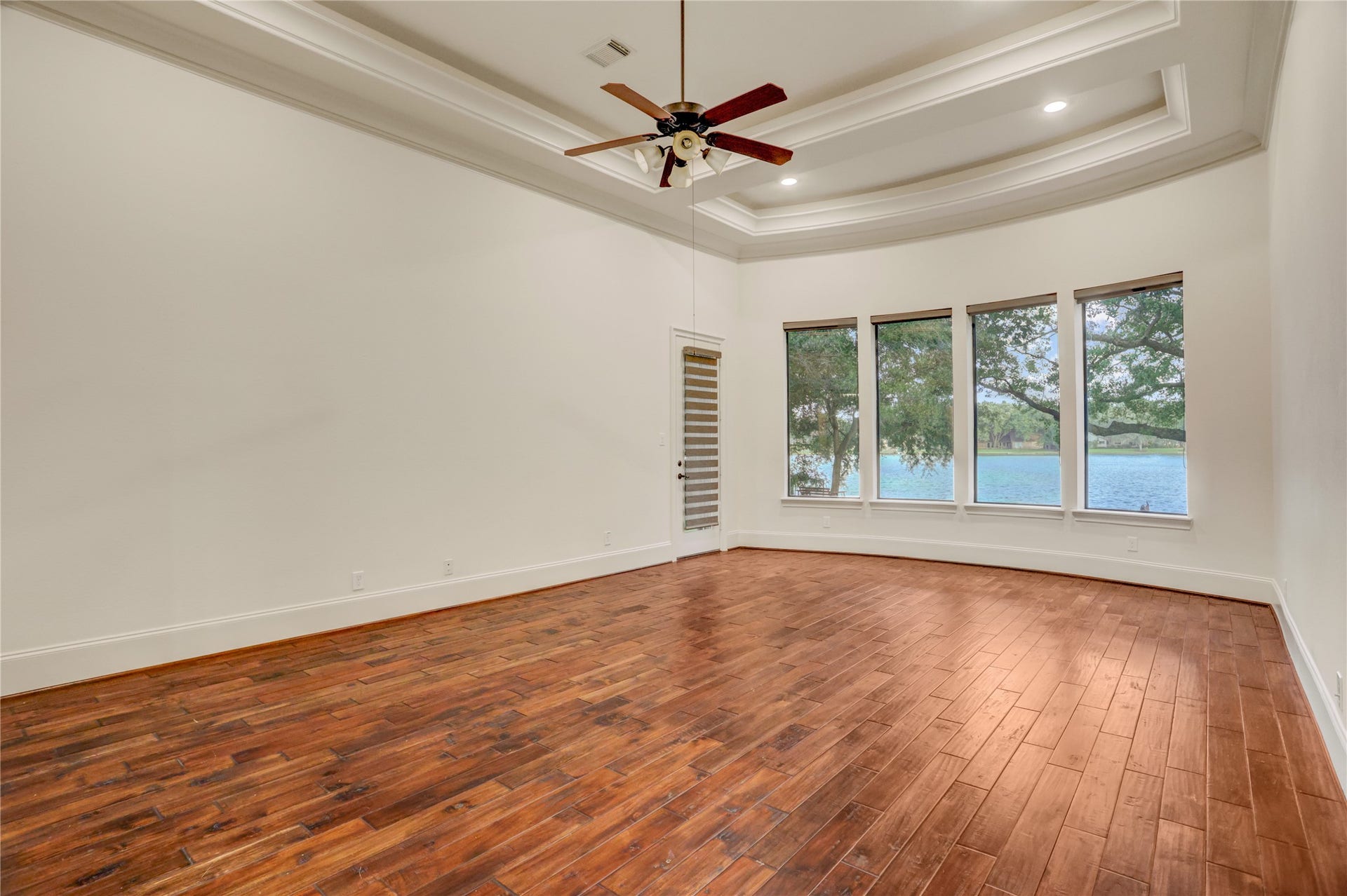 702 Piedmont Street, Sugar Land, TX 77478 The view from the expansive primary bedroom is extraordinary, and the long-range view provides privacy