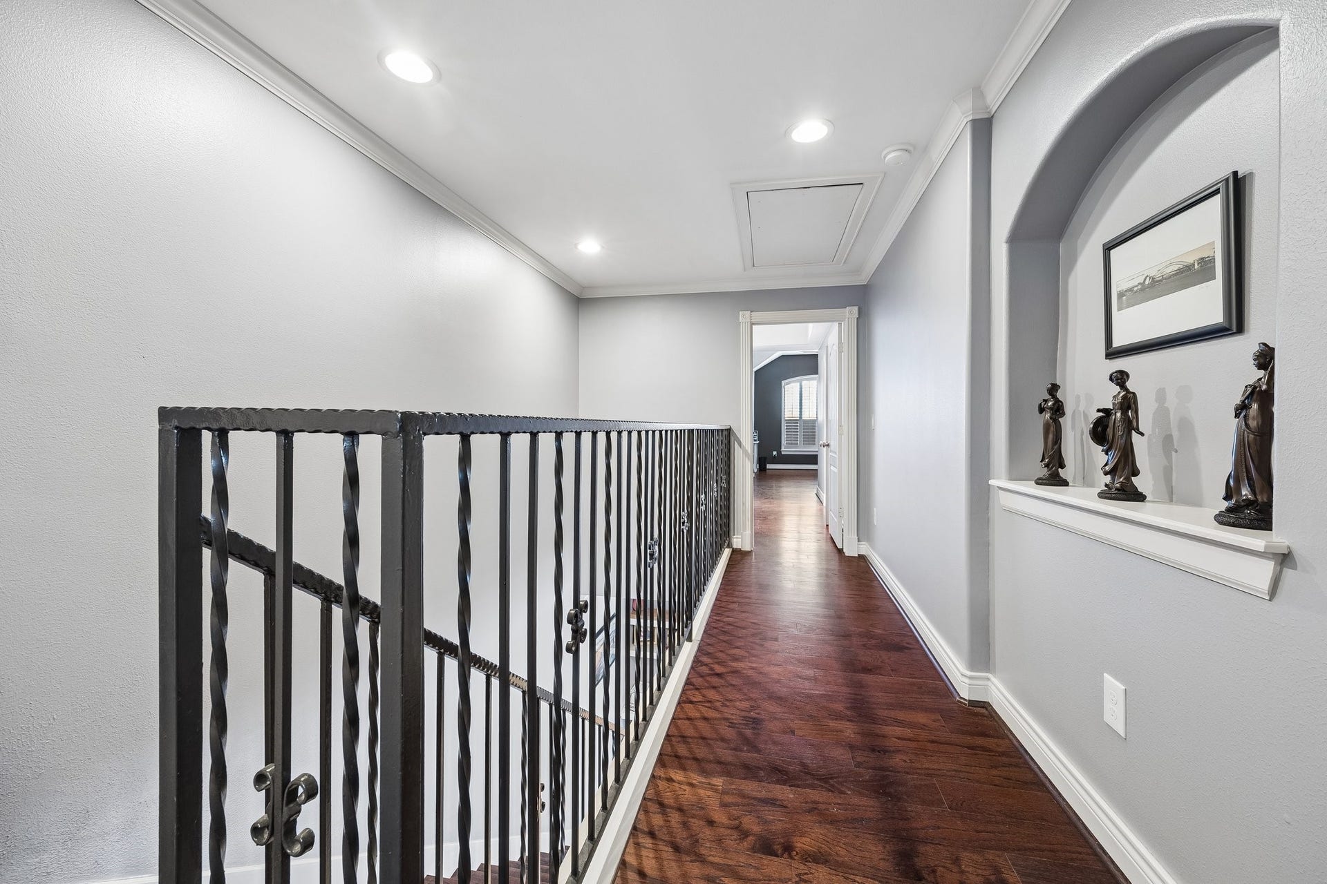 The beautiful corridor leads to the foyer for the primary bath