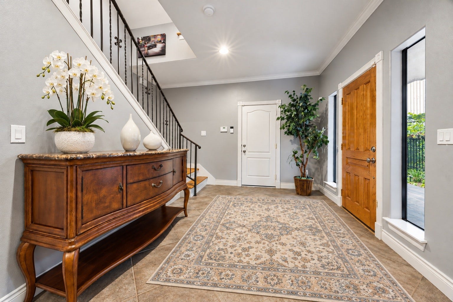 Large formal entry with high ceiling, Large floor to ceiling windows providing loads of light