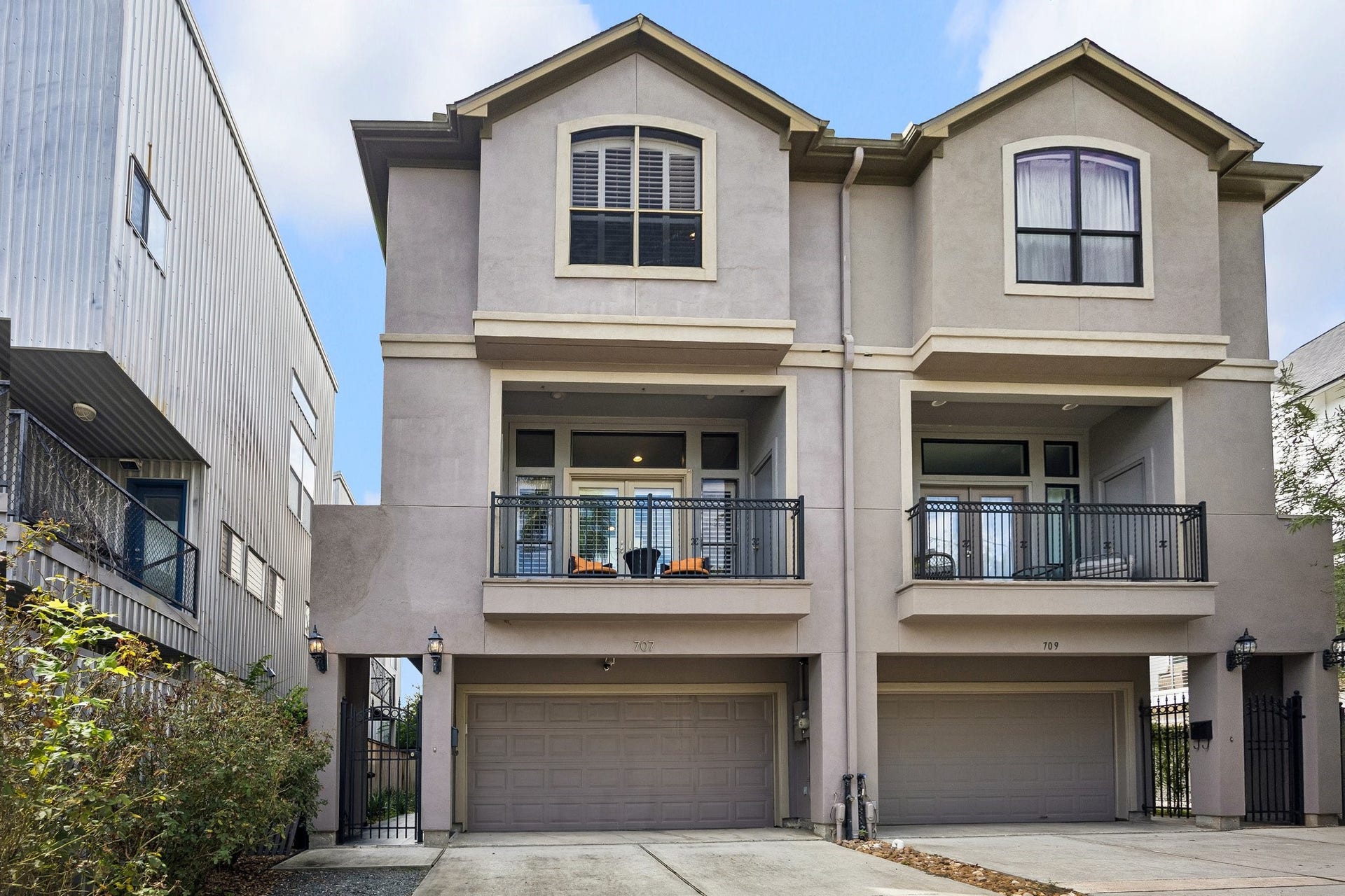 Handsome town home with double drive way and gated landscaped entry to the front door. Large balcony off the Family Room