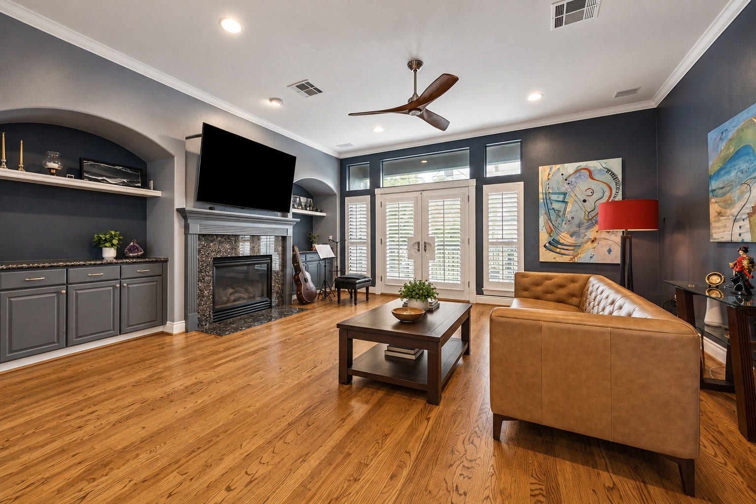 The family room boasts beautiful built in areas and gas log fireplace all opening through the French doors to one of the 2 balconies on the 2nd floor