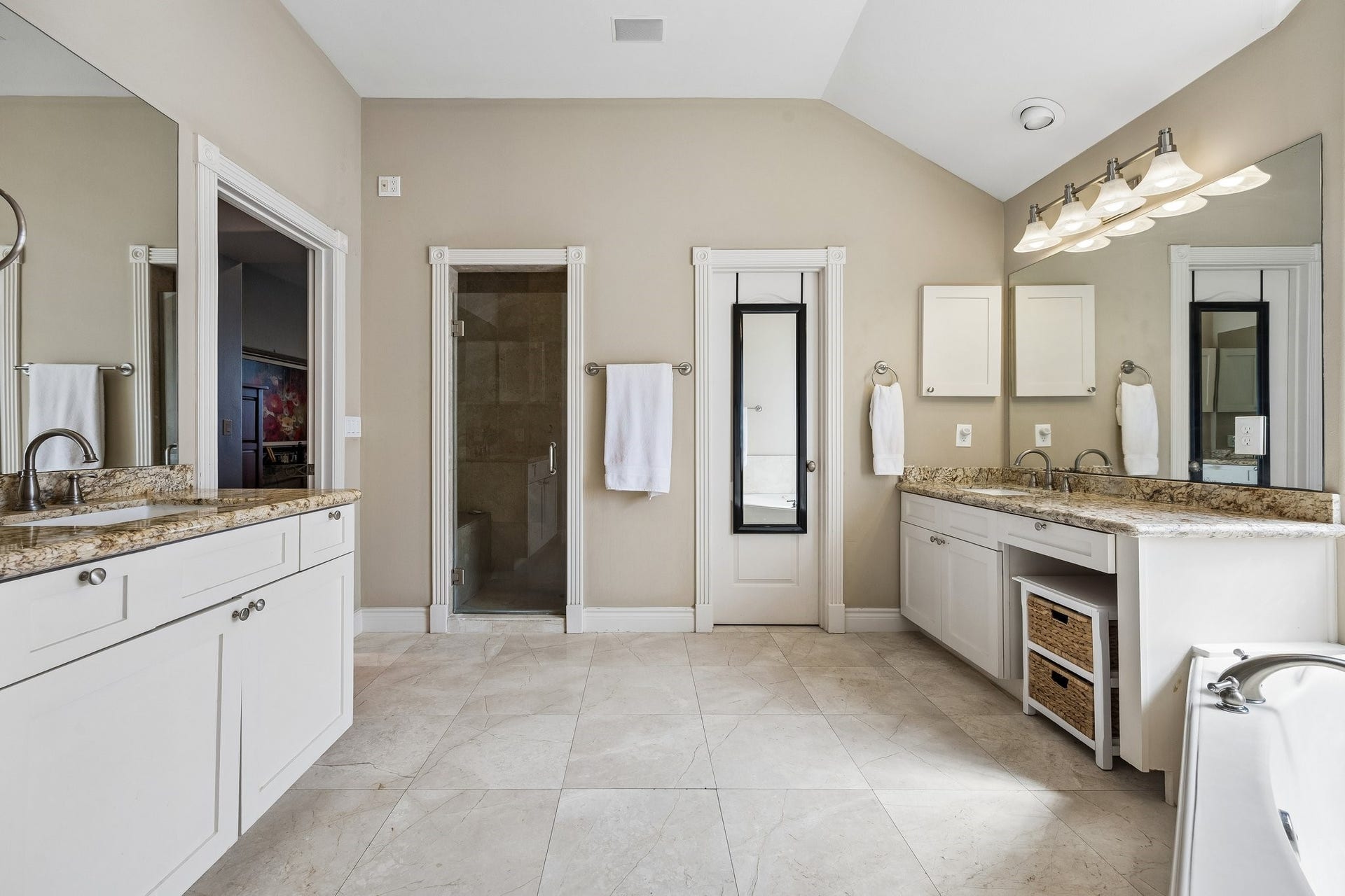 This lovely bath has double sink areas, a separate shower and jetted tub and a generous walk in closet