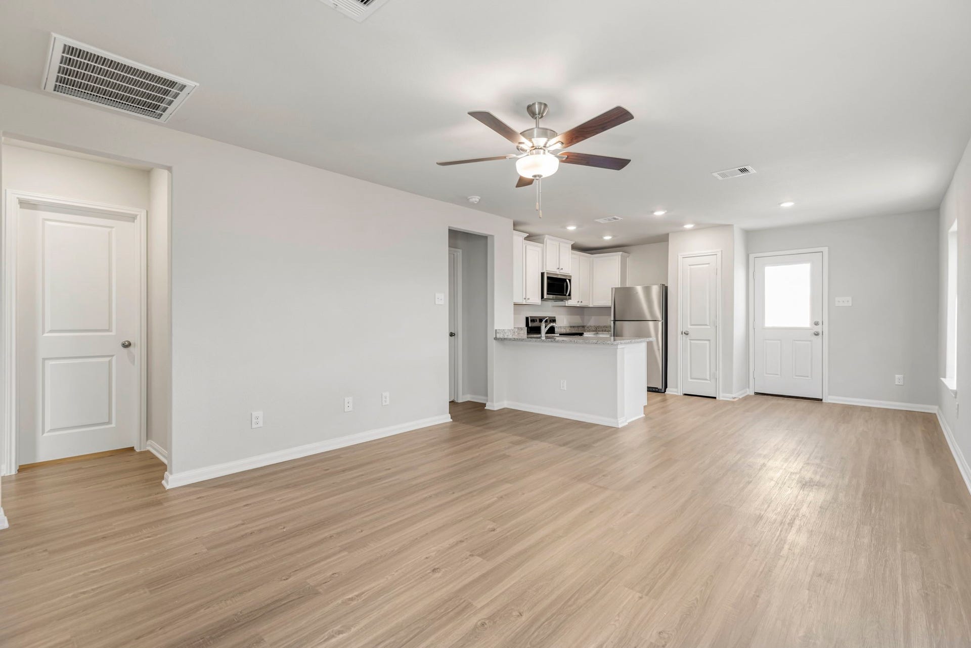 6423 Autumn Equinox Drive, Houston, TX 77048 The living room has plenty of space to gather with your family and friends.