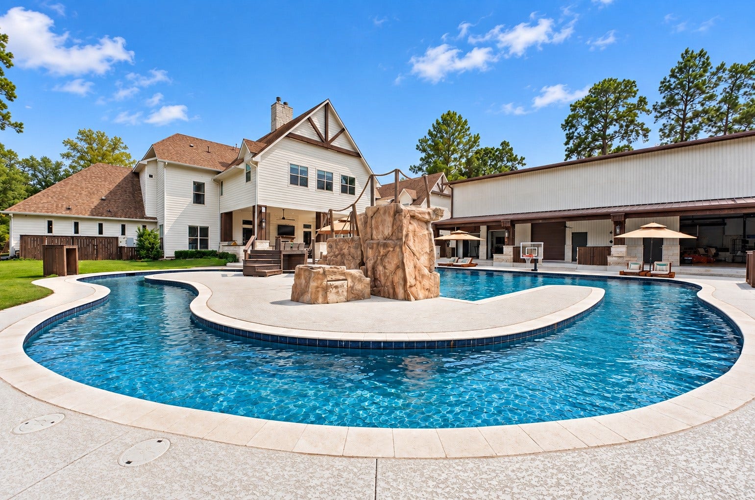 37753 Marias Way, Magnolia, TX 77354 The resort-style pool and lazy river create an incredible backyard retreat, complete with a rock waterfall, spa and expansive areas for relaxing, entertaining and enjoying the outdoors.