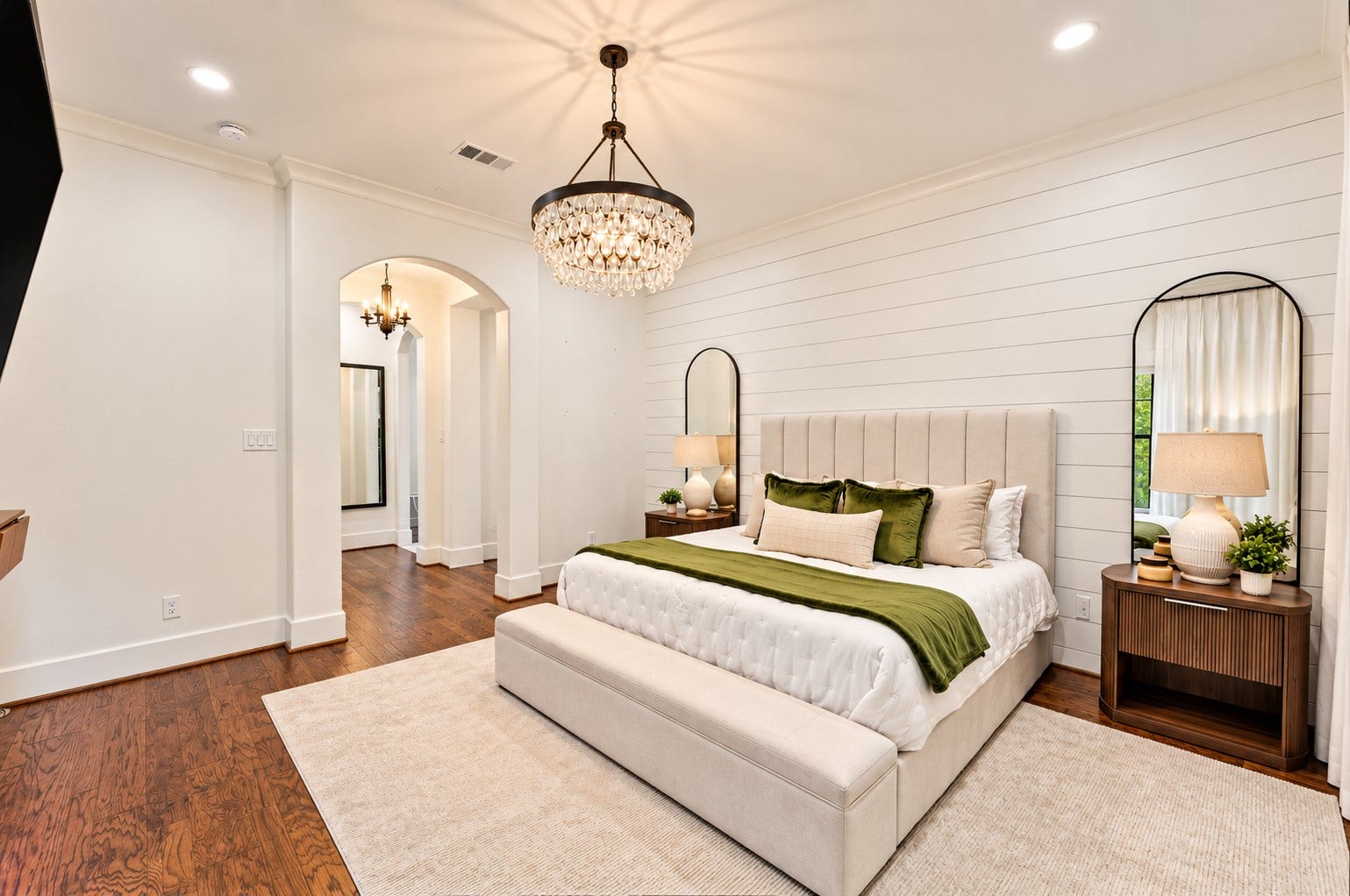 37753 Marias Way, Magnolia, TX 77354 The spacious first-floor primary suite offers a peaceful retreat with a sitting area, warm hardwood floors and plenty of natural light.