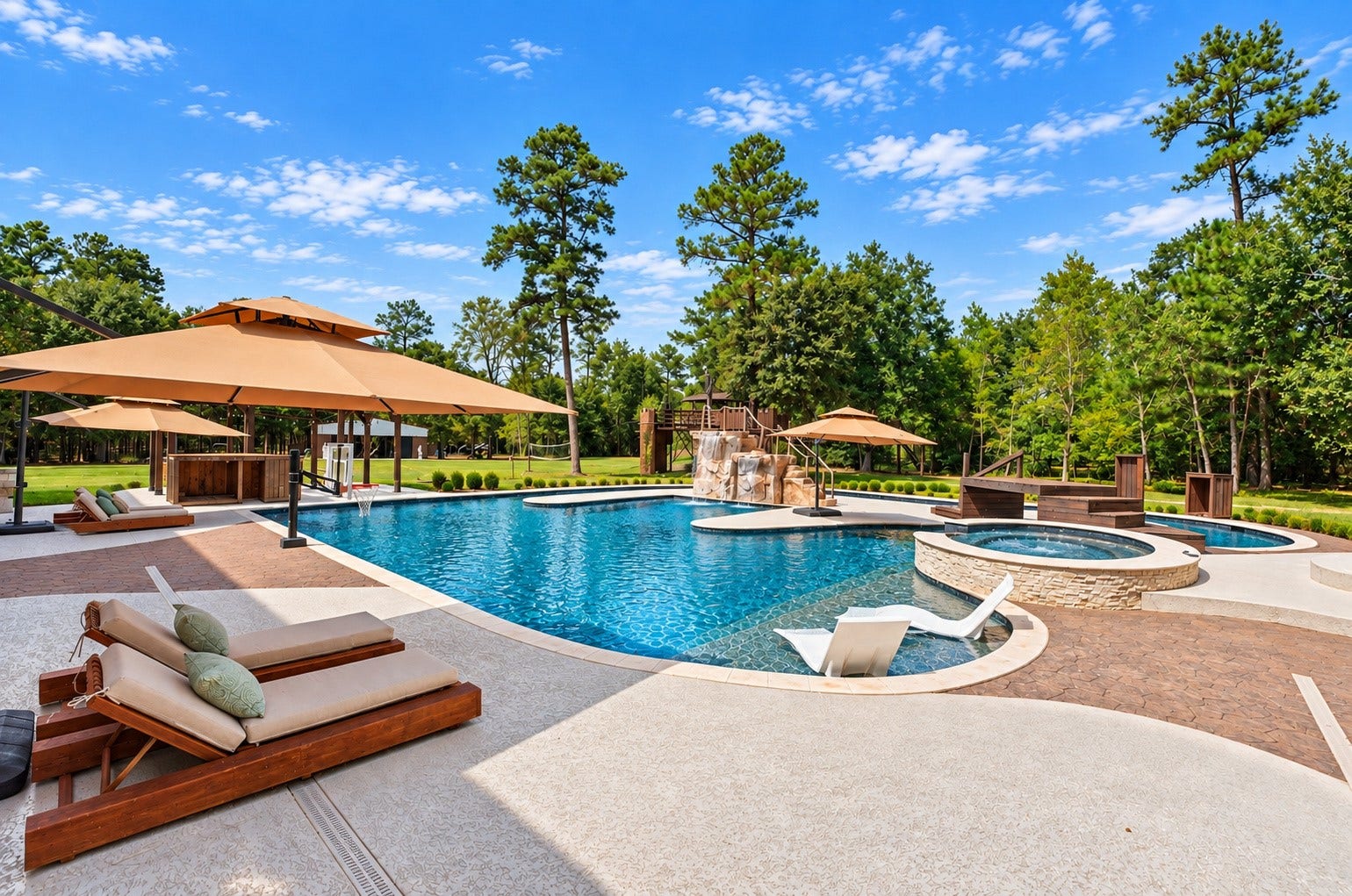 37753 Marias Way, Magnolia, TX 77354 Another view of the backyard retreat showcases the expansive pool complex, spa, multiple lounging areas and surrounding outdoor spaces designed for recreation and entertaining.