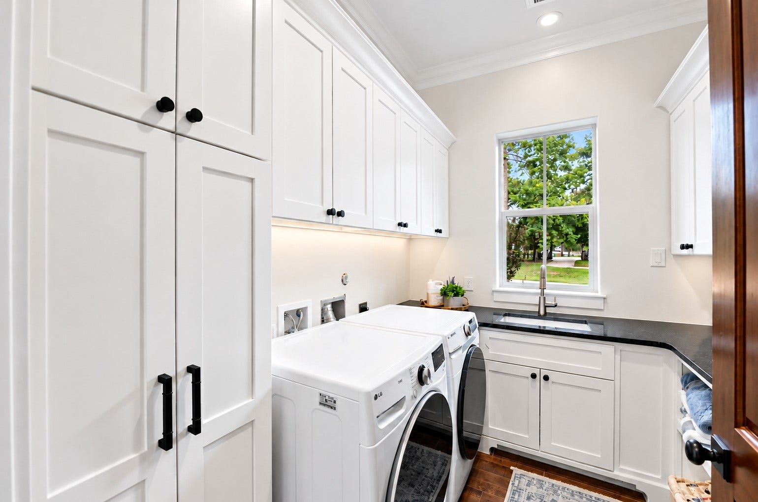 37753 Marias Way, Magnolia, TX 77354 The main level includes a spacious laundry room with extensive cabinetry, counter space, a utility sink and abundant storage.
