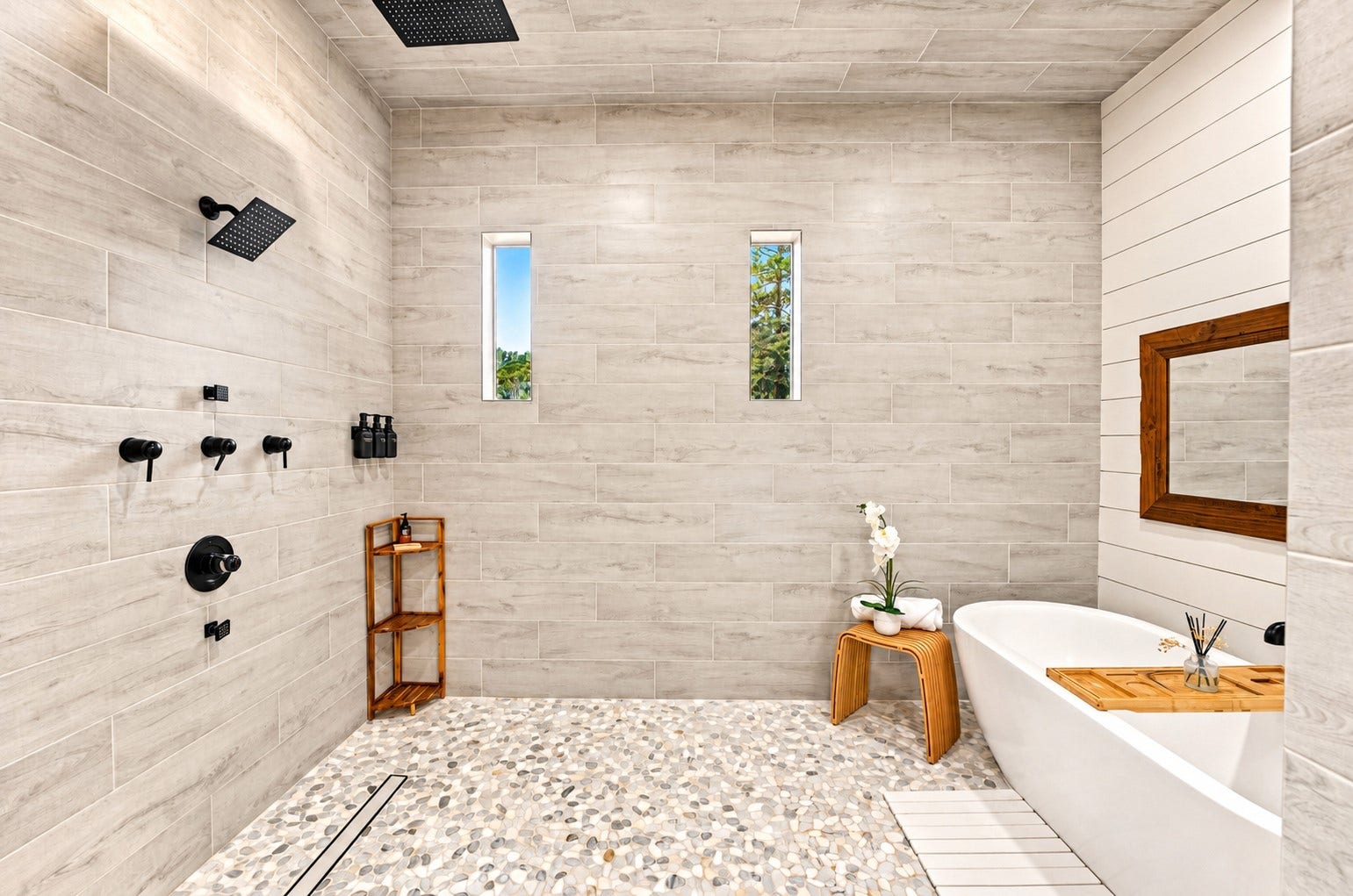 37753 Marias Way, Magnolia, TX 77354 The primary bath continues with an oversized walk-in shower featuring multiple shower heads, complemented by a freestanding soaking tub for a spa-like retreat.