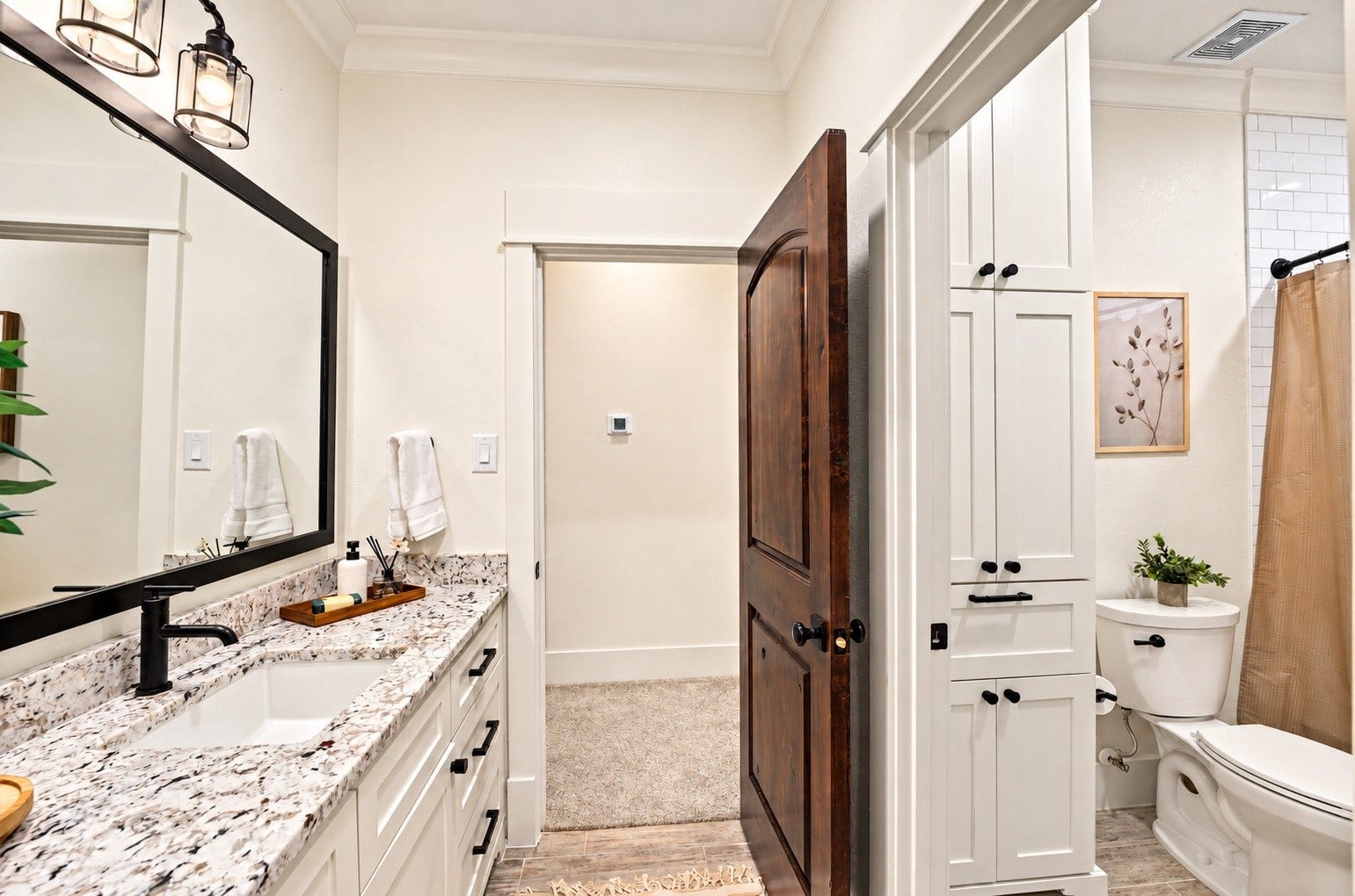 37753 Marias Way, Magnolia, TX 77354 The adjoining bath features a spacious vanity with generous storage and a separate tub/shower area, creating a comfortable private setup for the adjoining bedroom.
