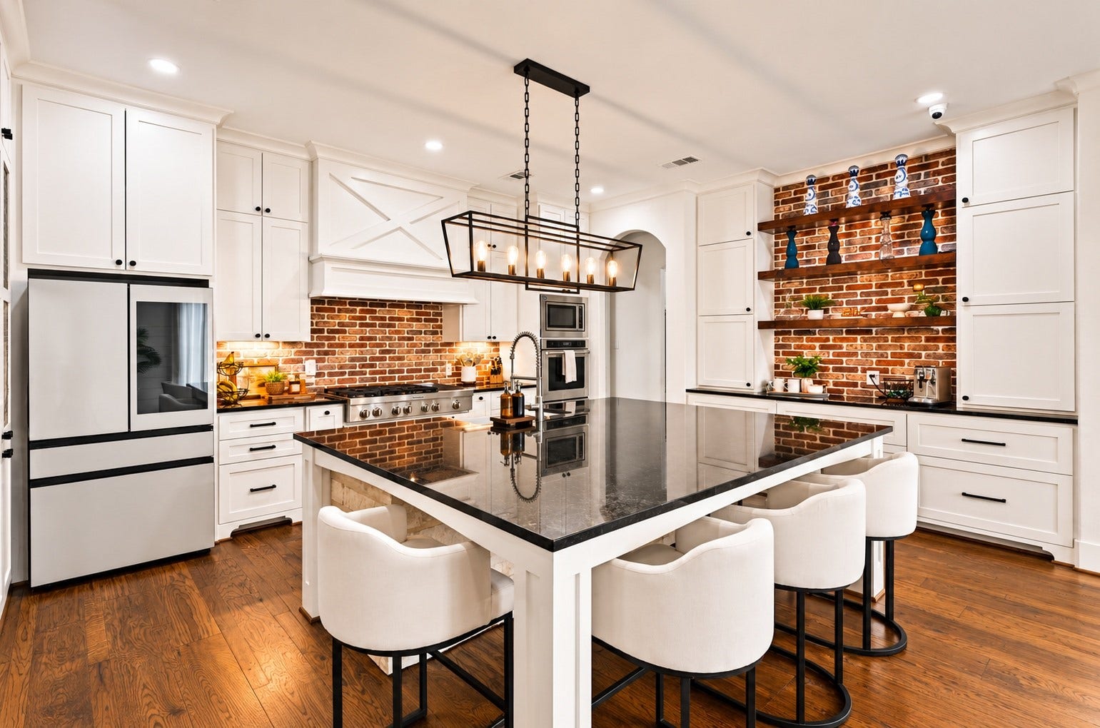 37753 Marias Way, Magnolia, TX 77354 The spacious kitchen centers around a large island with seating, granite countertops and abundant cabinetry, offering plenty of room for cooking, gathering and entertaining.