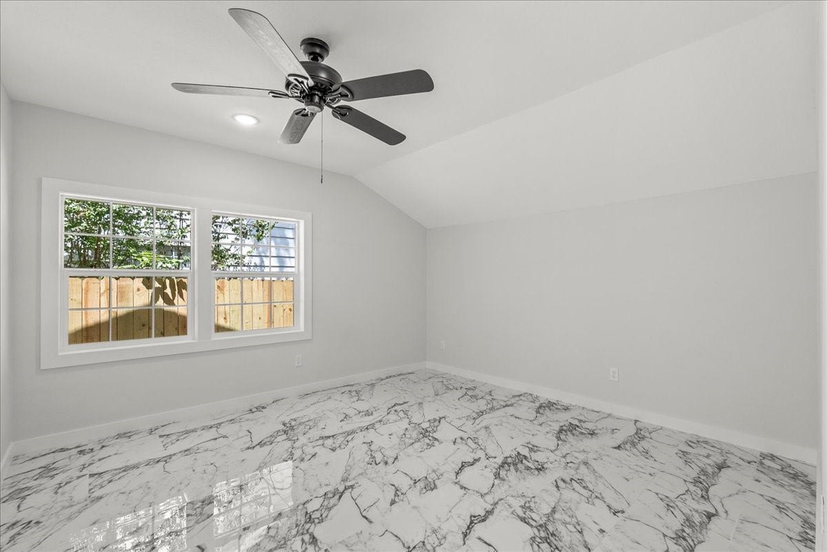 1105 W Ellaine Avenue, Pasadena, TX 77506 Private primary suite with ceiling fan and generous layout.
