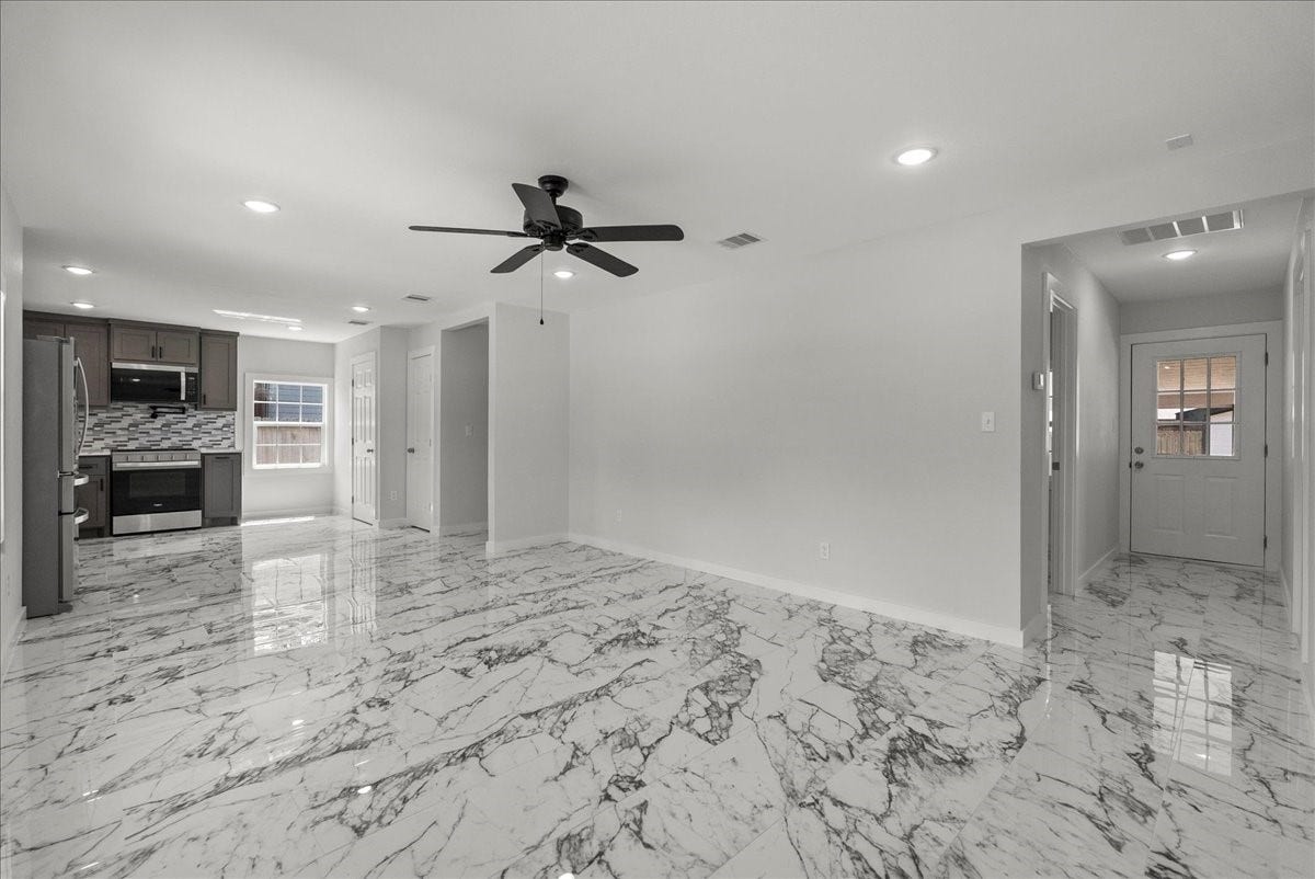 1105 W Ellaine Avenue, Pasadena, TX 77506 Open floor plan seamlessly connecting the living and dining areas.