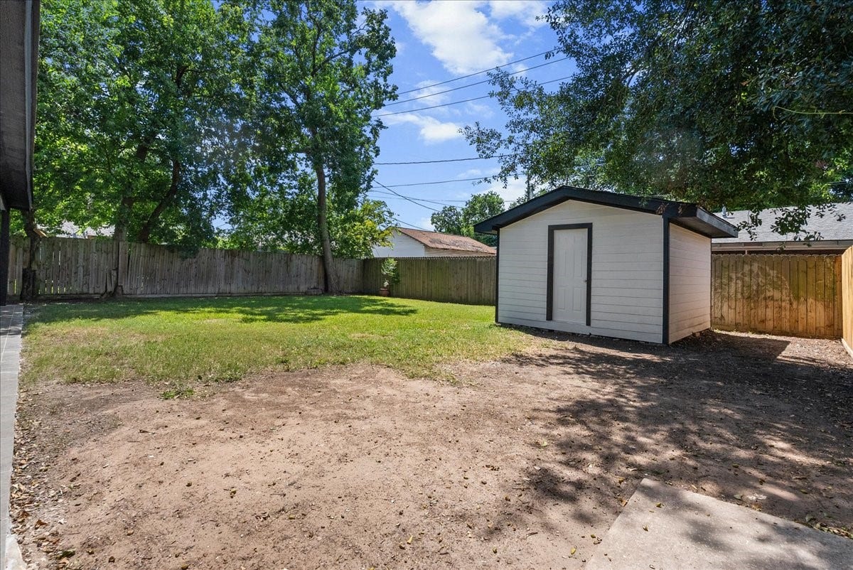 1105 W Ellaine Avenue, Pasadena, TX 77506 Fully fenced backyard with plenty of room for recreation and gatherings.