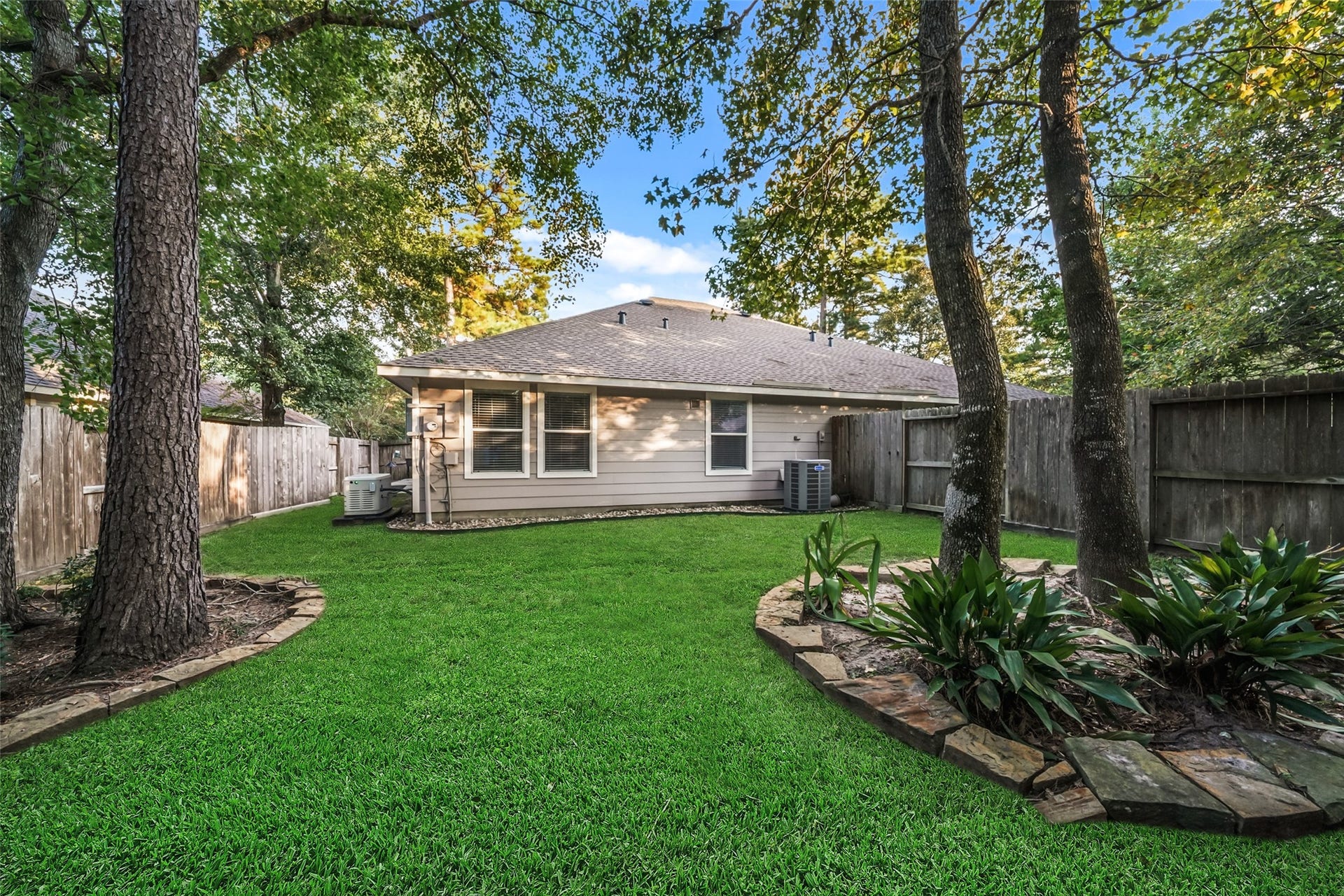 7 Fitzroy Place, Conroe, TX 77384 A view of from the back yard. Mature trees and landscape are easy to maintain.
Front yards are maintained by the HOA!