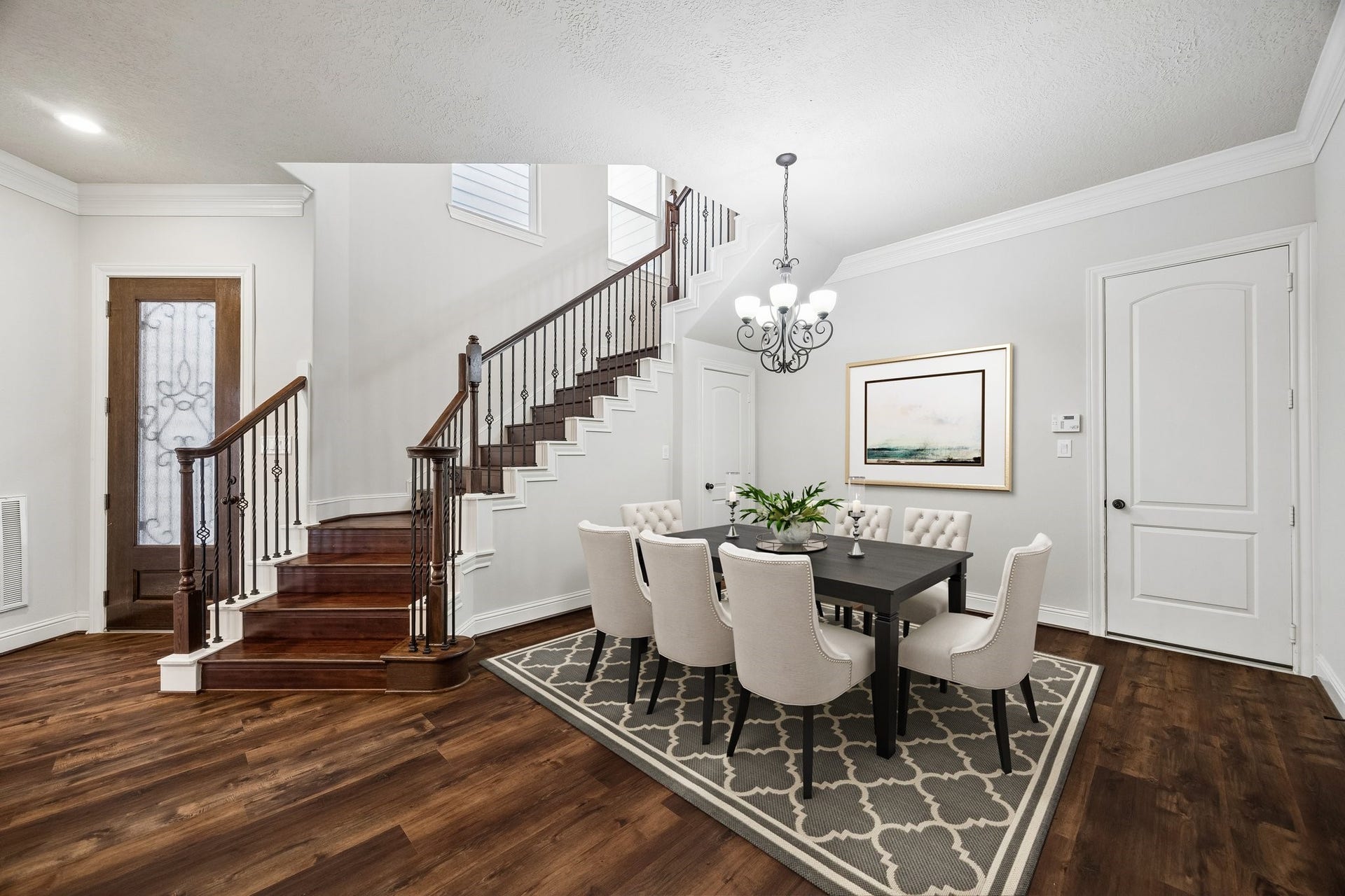 5513 Petty Street, #C, Houston, TX 77007 Spacious dining area with stylish staircase and functional layout.