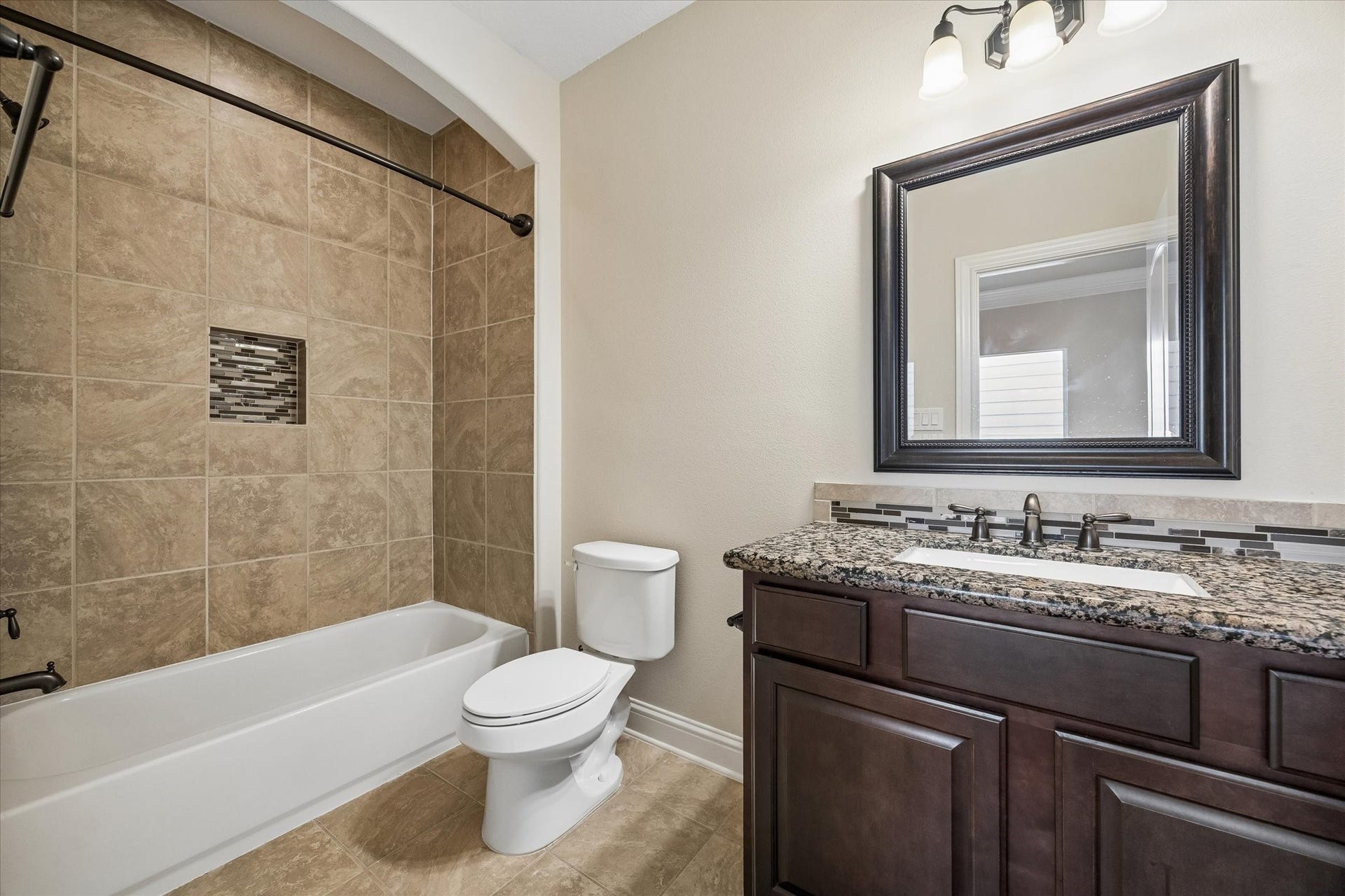 5513 Petty Street, #C, Houston, TX 77007 Full bathroom with vanity storage and tub-shower combination.