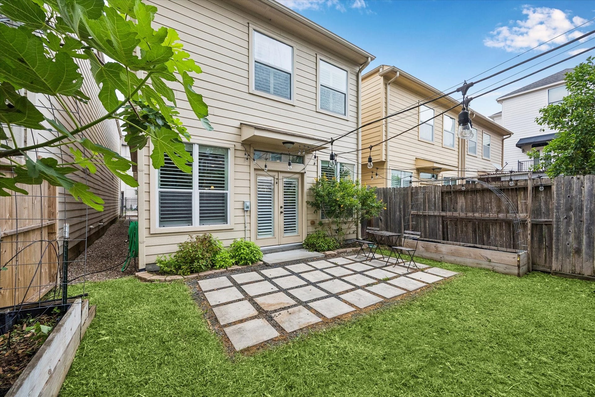 5513 Petty Street, #C, Houston, TX 77007 Private backyard with patio grid design and low-maintenance green space.