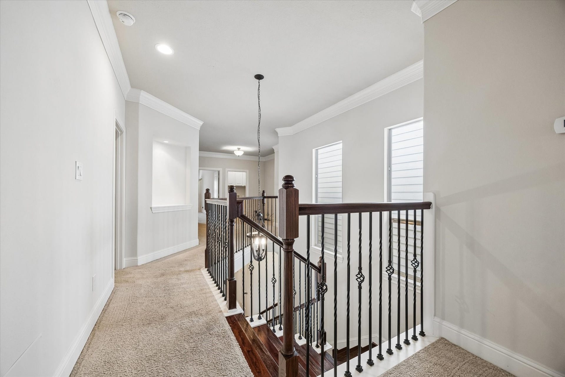 5513 Petty Street, #C, Houston, TX 77007 Upstairs landing with open railing and convenient access to secondary rooms.
