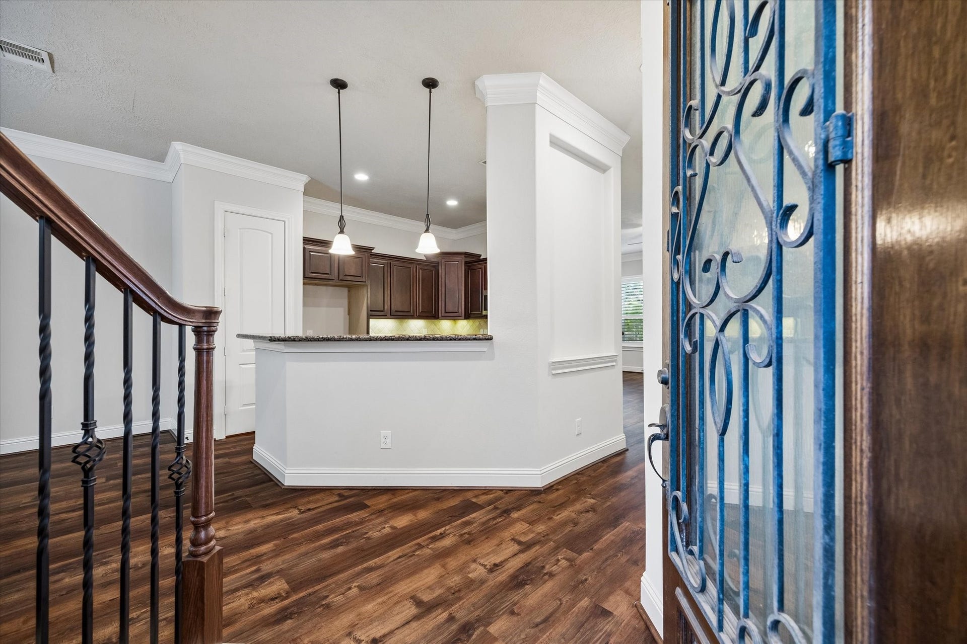 5513 Petty Street, #C, Houston, TX 77007 Welcoming entry with open-concept design and elegant staircase details.