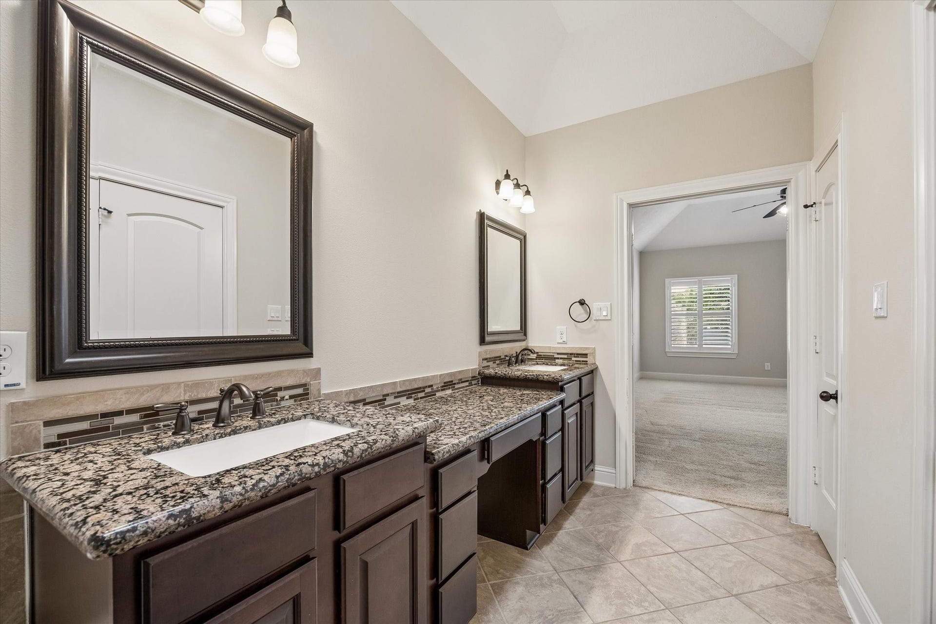 5513 Petty Street, #C, Houston, TX 77007 Primary bath featuring double sinks, ample storage, and elegant finishes.