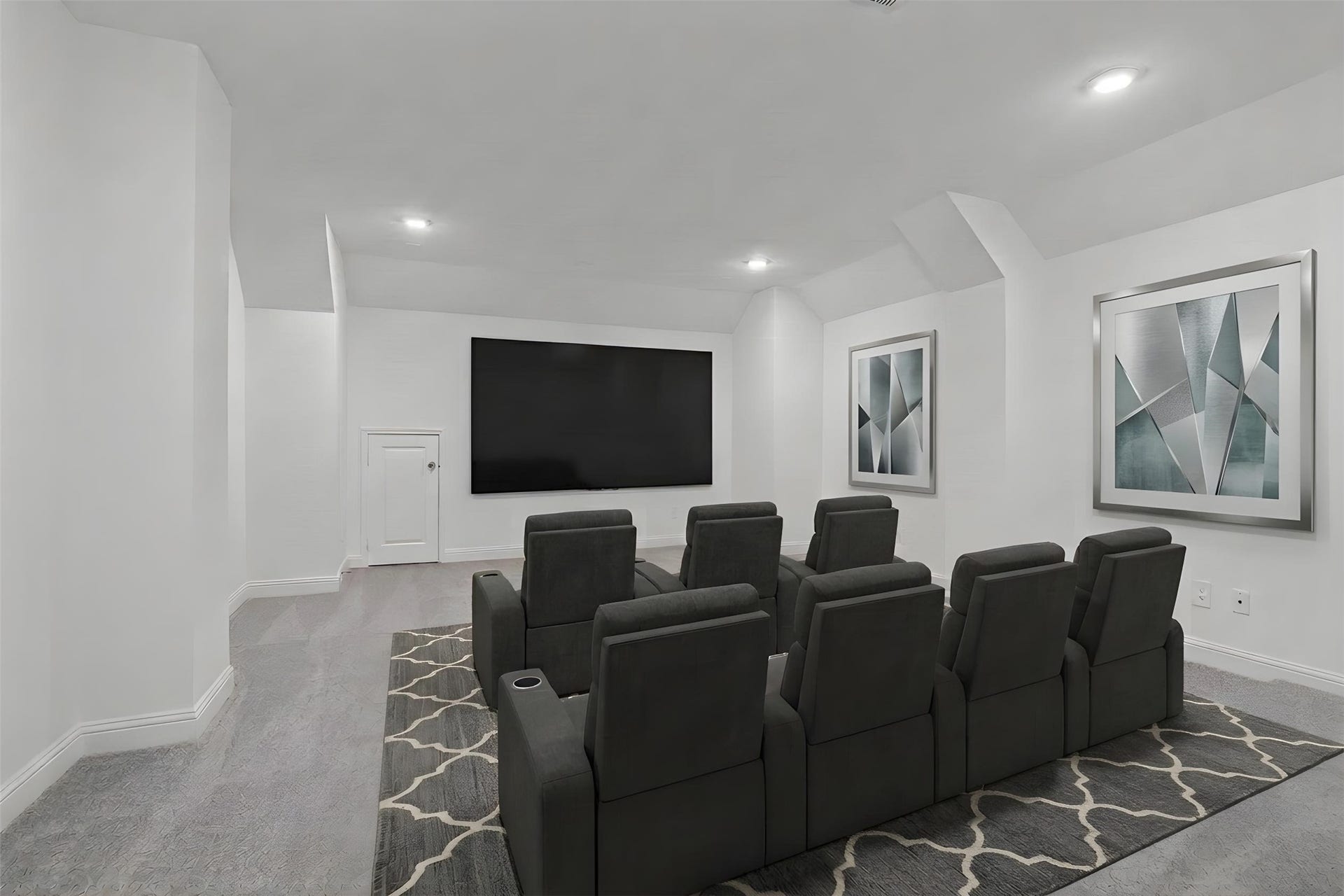 Grab the popcorn, put on a movie, and enjoy a wonderful evening in your amazing media room! Featuring plush carpet, custom paint, custom lighting makes this the perfect room for relaxing! *Virtually Staged