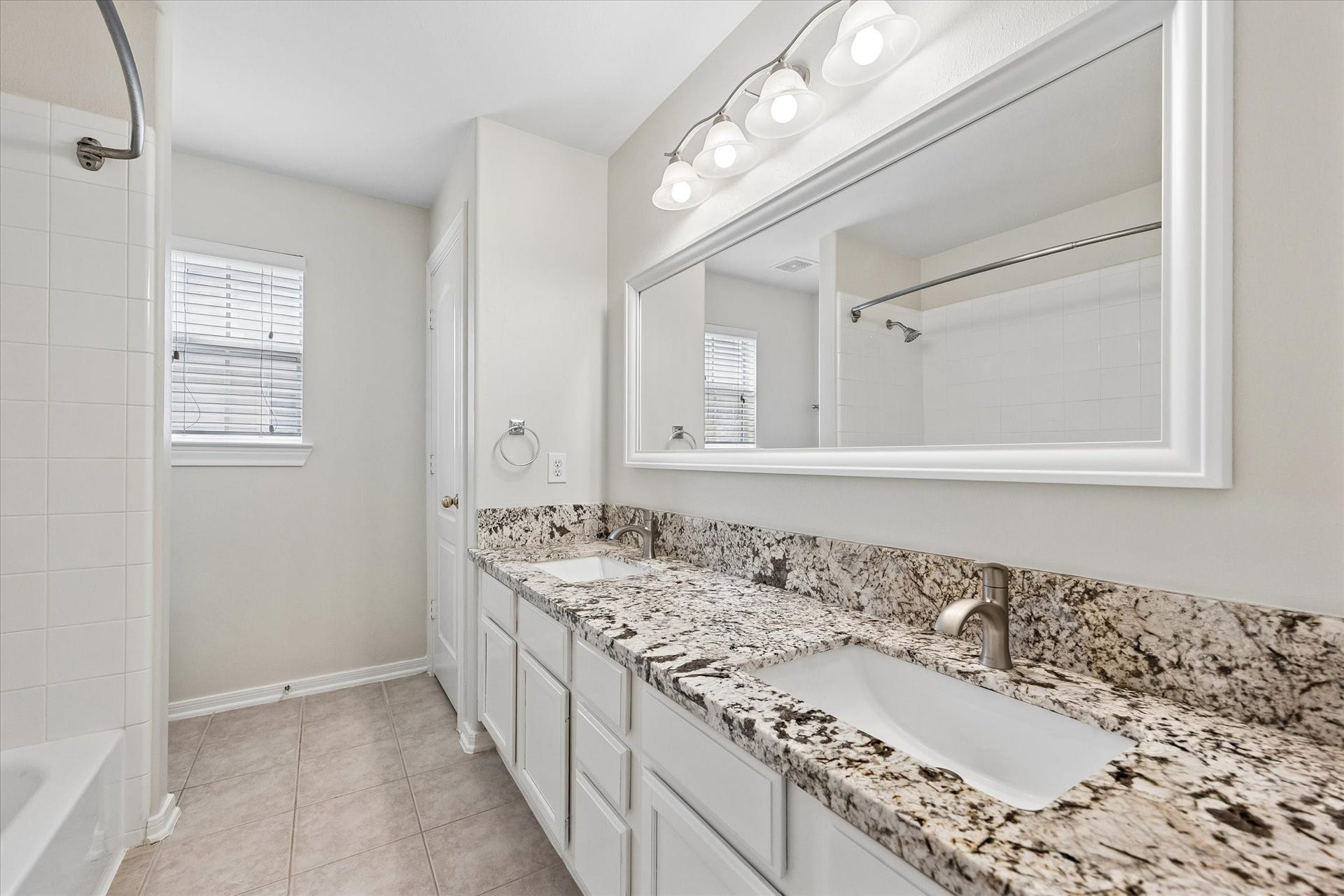 1502 Lakeside Enclave Drive, Houston, TX 77077 Upstairs Bath with double sinks and tub/shower.
