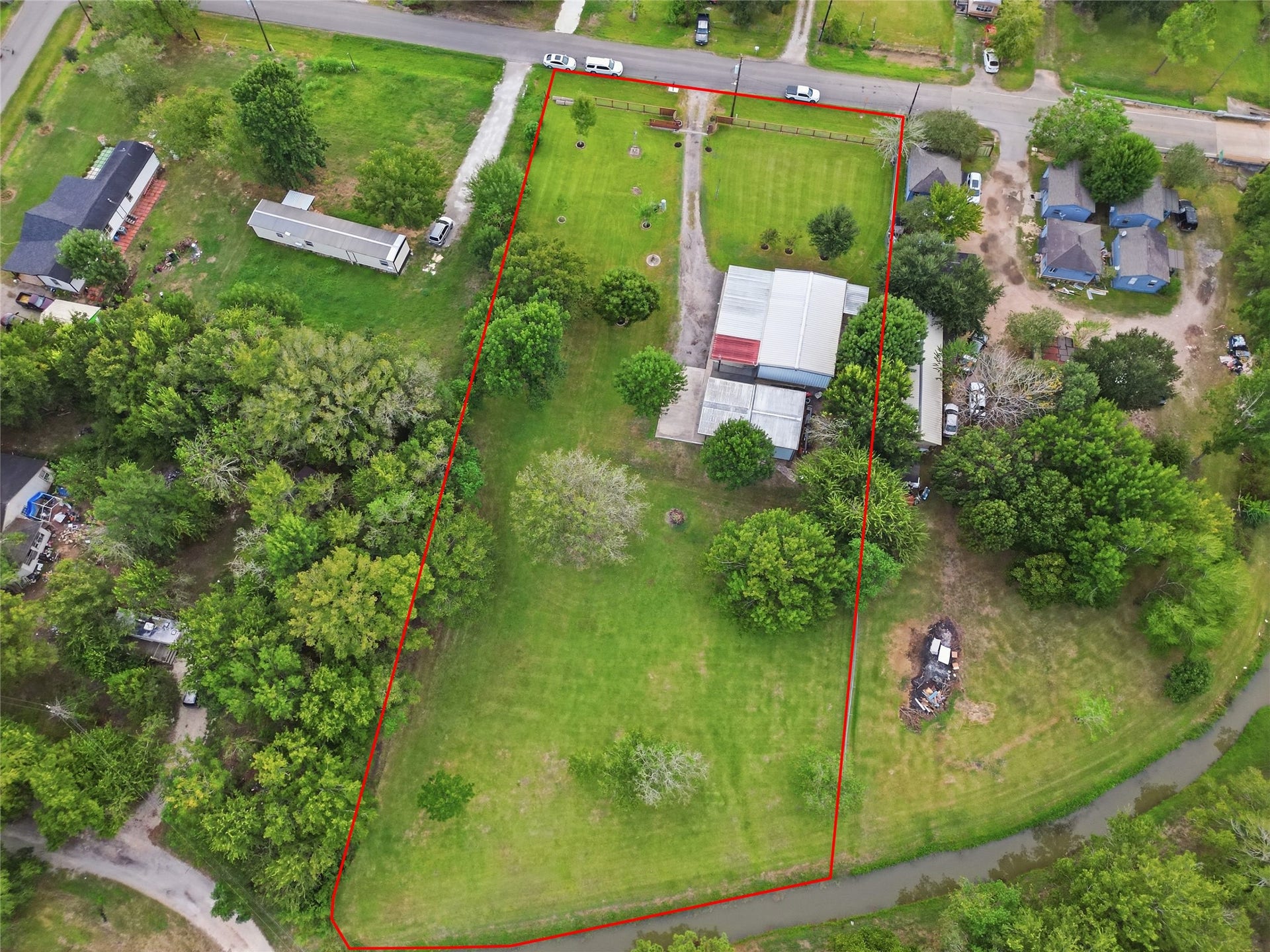 18503 Frazier Drive, #C176C, Pearland, TX 77584 Additional aerial perspective highlighting the impressive lot size, wide- open green space mature landscaping, residence.
