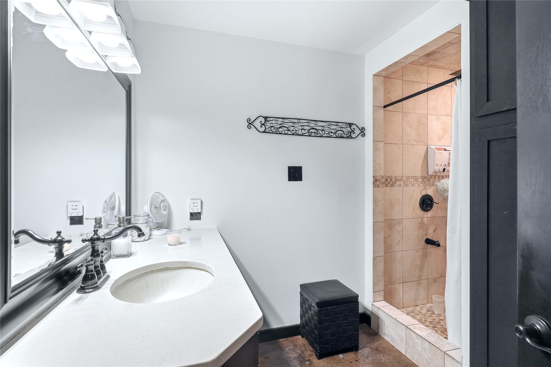 18503 Frazier Drive, #C176C, Pearland, TX 77584 Bright bathroom featuring a spacious vanity with generous countertop space, large mirror, and titled walk-in shower with dark fixtures