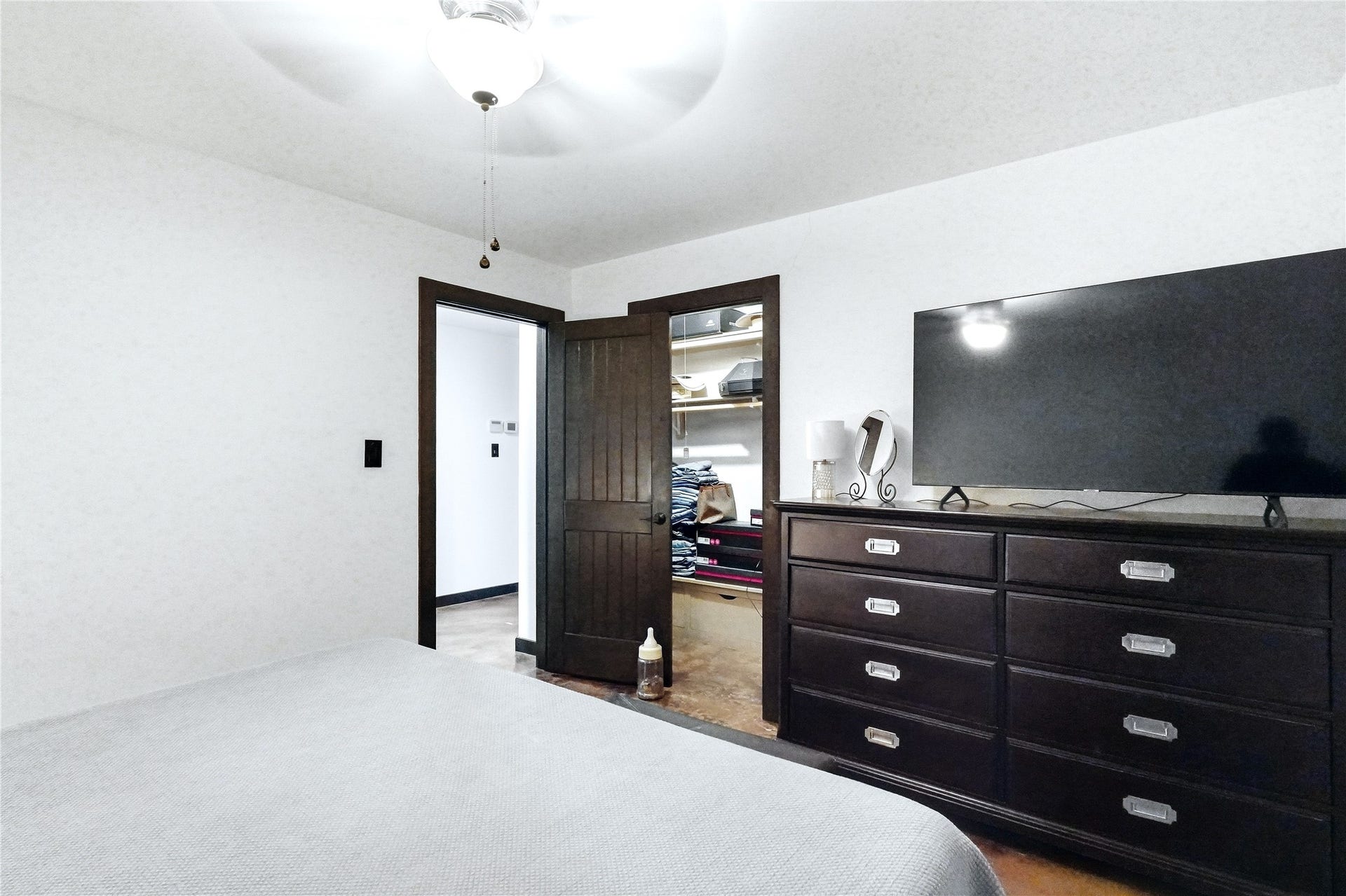18503 Frazier Drive, #C176C, Pearland, TX 77584 Spacious bedroom featuring neutral finishes,ceiling fan, walk-in closet, and ample storage with room for a large dresser.
