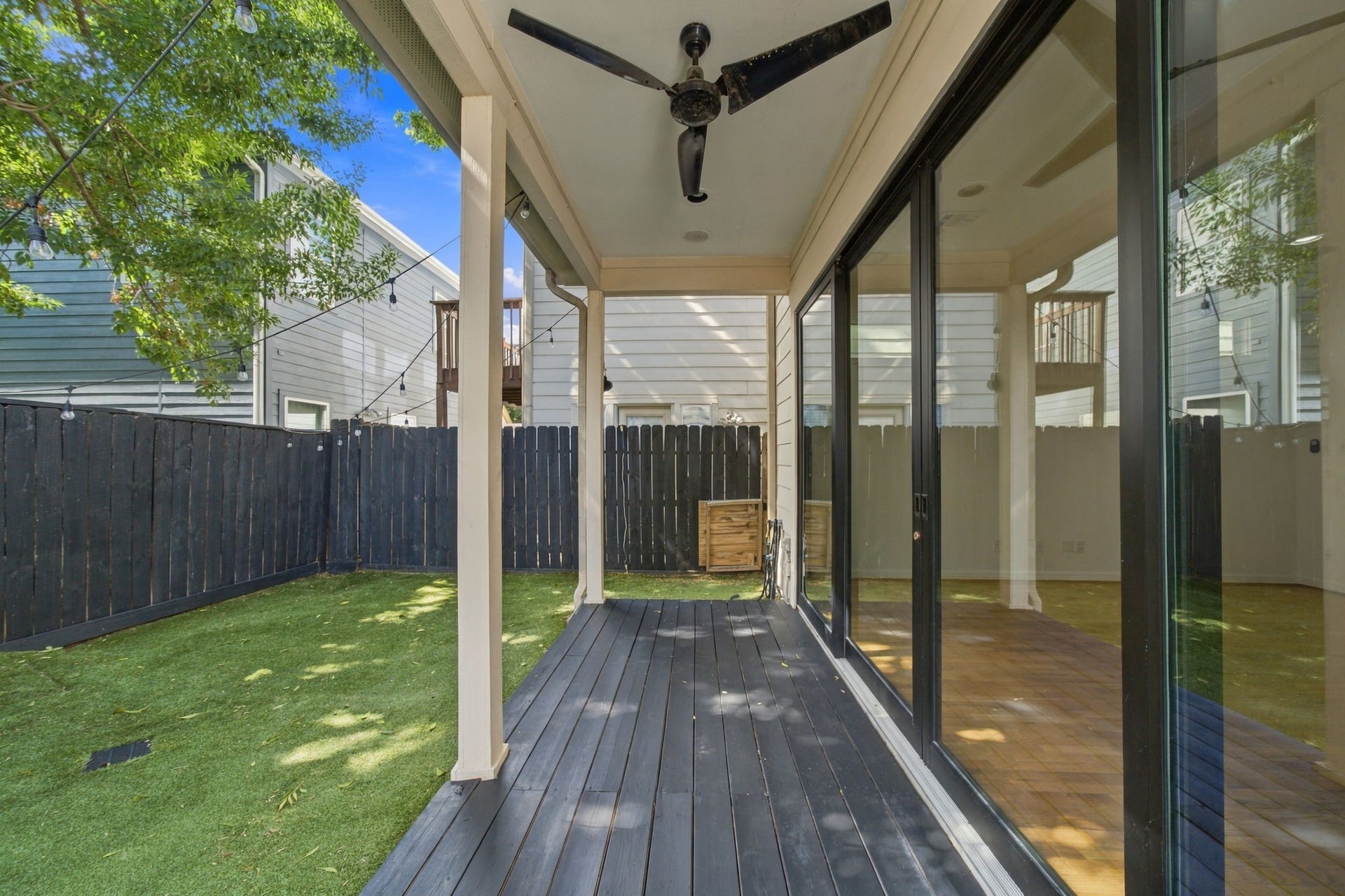 6113 Maxie Street, Houston, TX 77007 Enjoy easy indoor-outdoor living with recently installed sliding glass doors opening to a covered patio with ceiling fan, string lighting & low-maintenance turf backyard. A wonderful space for relaxing or entertaining.