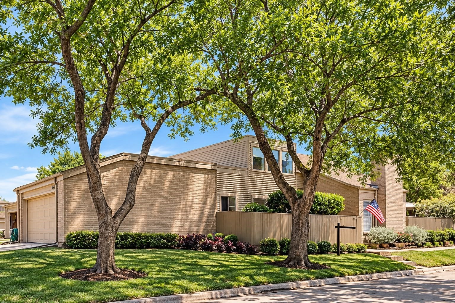 1402 Chardonnay Drive, Houston, TX 77077 Welcoming clubhouse exterior with landscaped walkways, lush greenery, and inviting outdoor spaces.