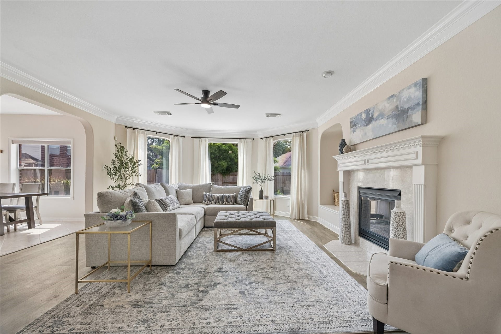 7503 Stone Arbor Drive, Sugar Land, TX 77479 The spacious family room is centered around a beautiful fireplace and framed by oversized windows that bring in abundant natural light. An open design makes it perfect for both everyday living and entertaining.