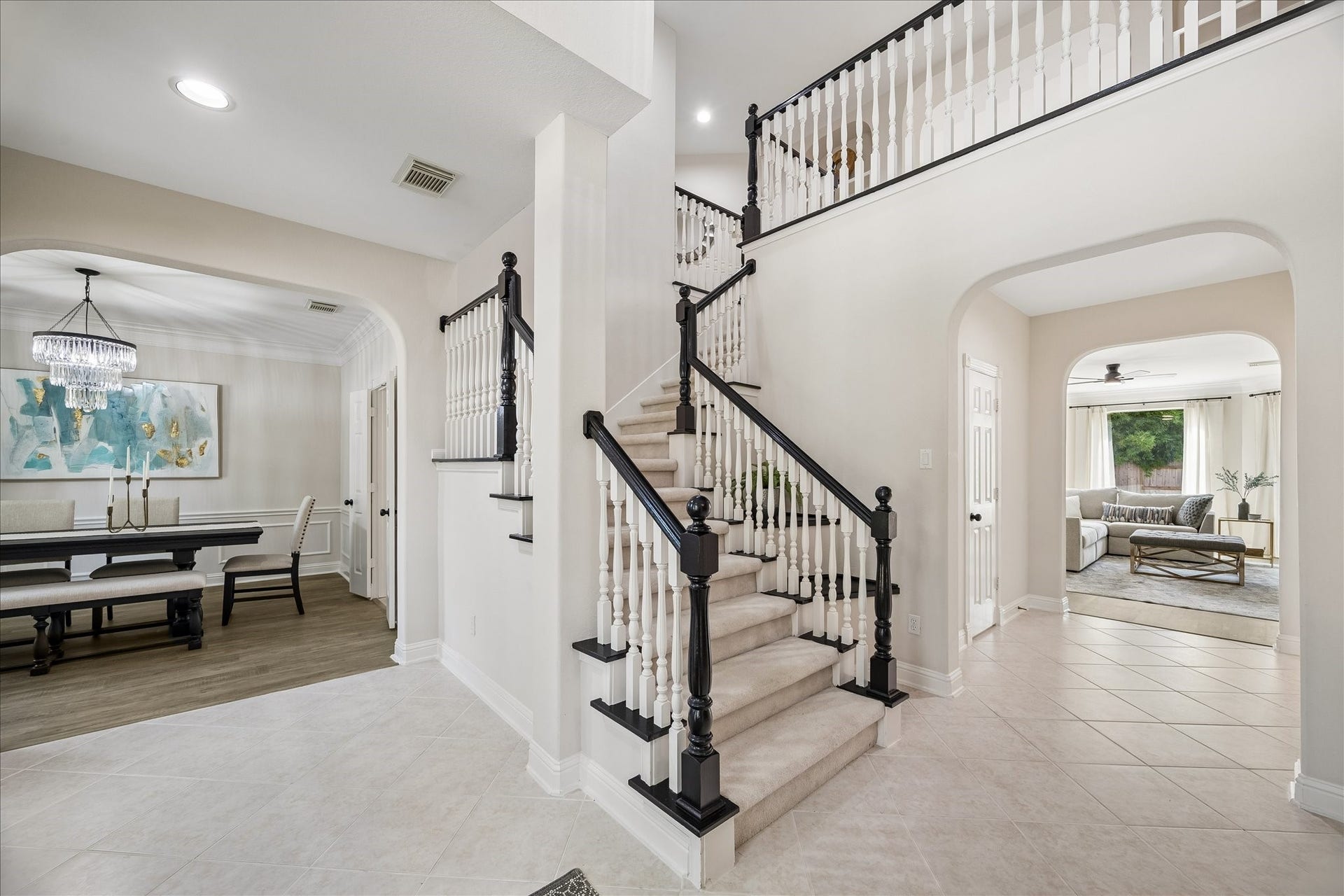 7503 Stone Arbor Drive, Sugar Land, TX 77479 Step inside to a grand two-story foyer featuring an elegant staircase and soaring ceilings that create an unforgettable first impression. The layout offers a seamless flow into the home's main living spaces.