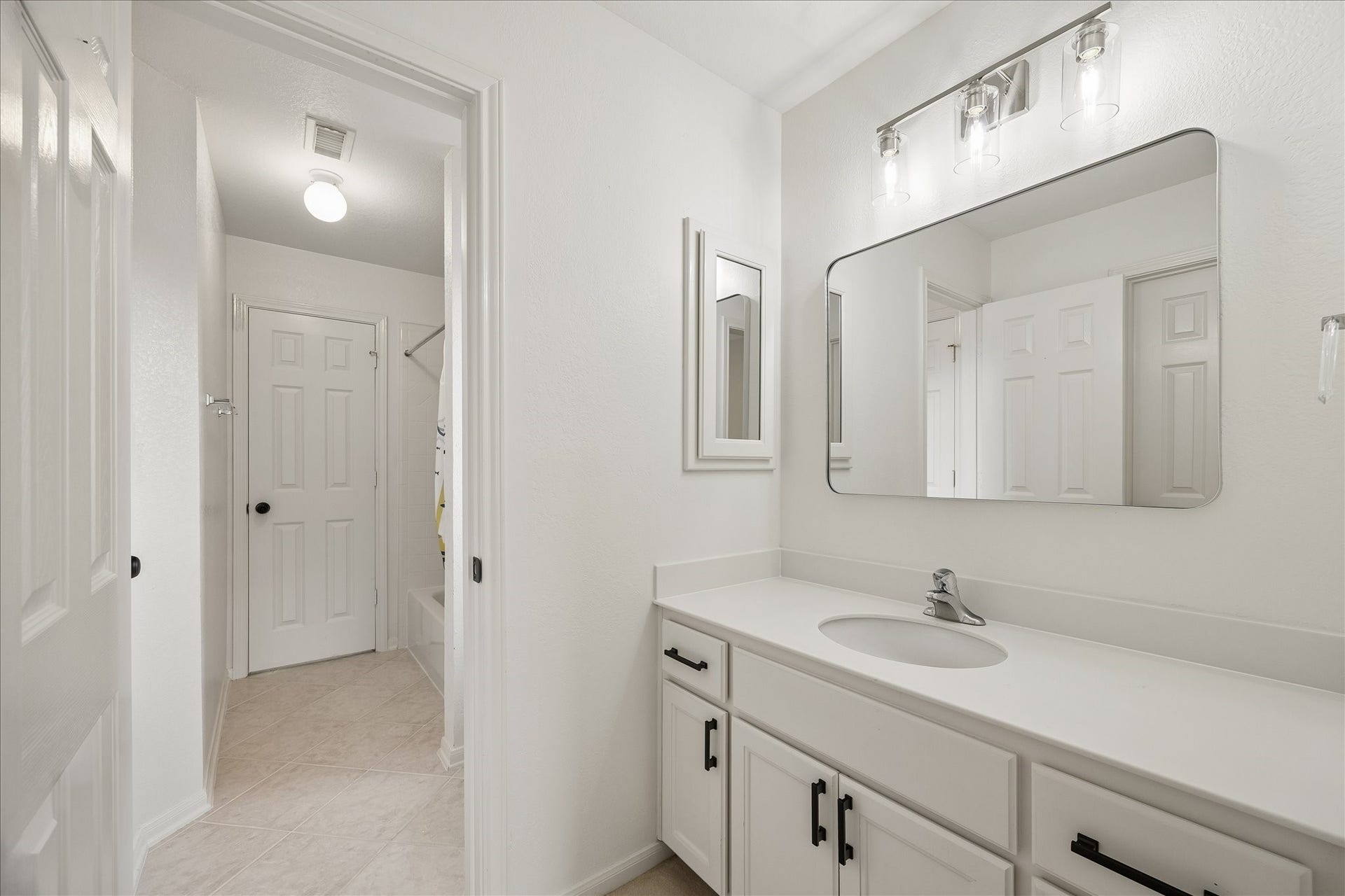 7503 Stone Arbor Drive, Sugar Land, TX 77479 Bright lighting and updated finishes create a fresh, inviting atmosphere throughout the bath. Easy access to the adjoining shower and dressing areas adds to the home's thoughtful design.
