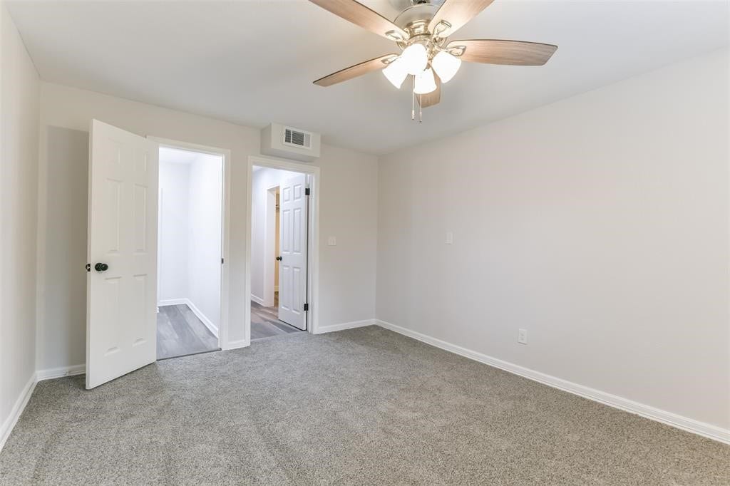 1309 W Lang Street, Alvin, TX 77511 Spacious Primary Suite in back of the home with Ceiling Fan