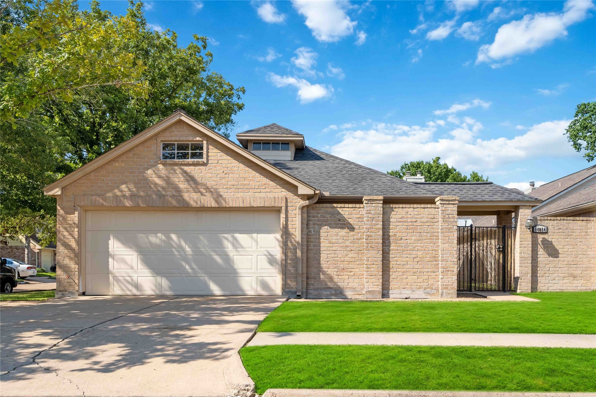 16054 Hidden Acres Drive, Houston, TX 77084 Great curb appeal! Corner lot and gated font entrance.