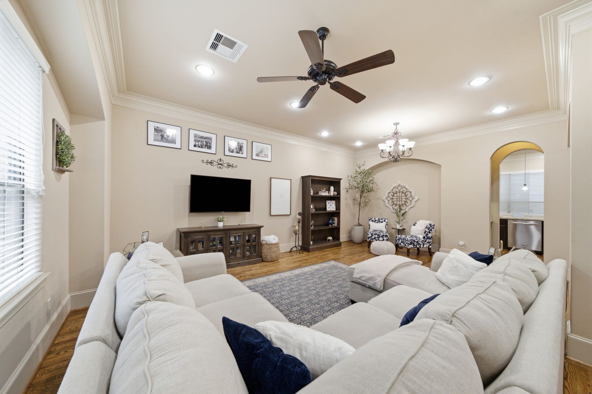 The Mediterranean influence of this home is continued with the arched niche and doorways.