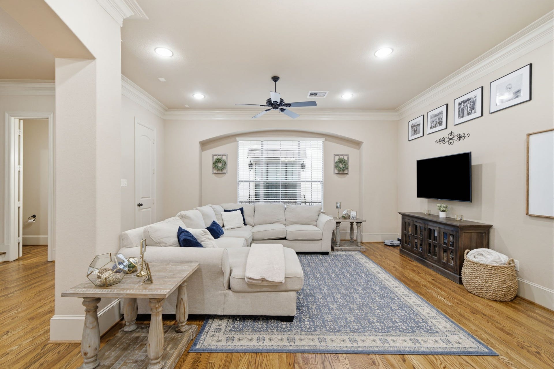 The perfect entertaining home with open concept living and dining area.  Half bath through the door on the left.