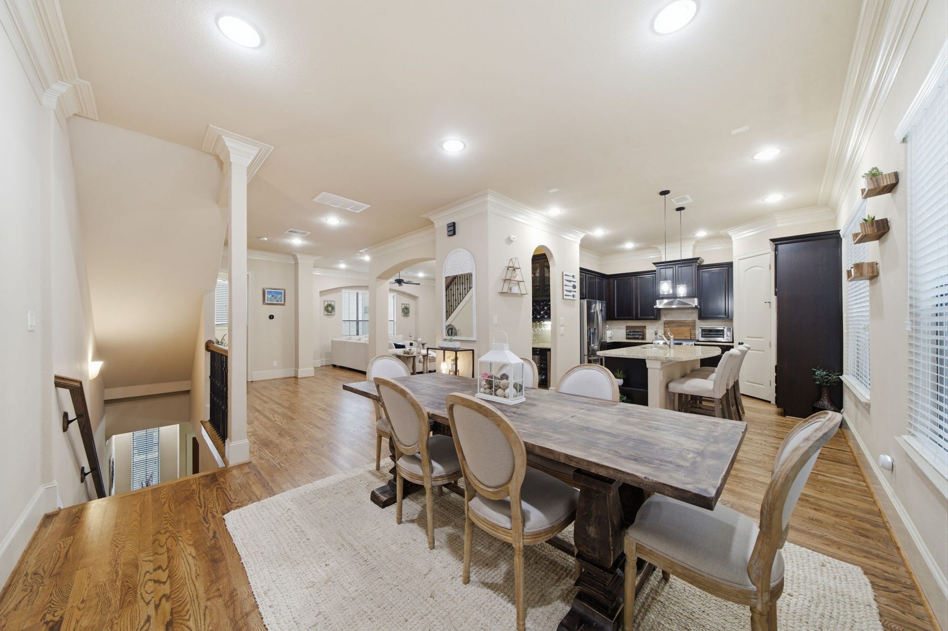 The entertaining level of this home has easy flow between living/dining/kitchen areas, all highlighted by the high ceilings and triple crown molding.
