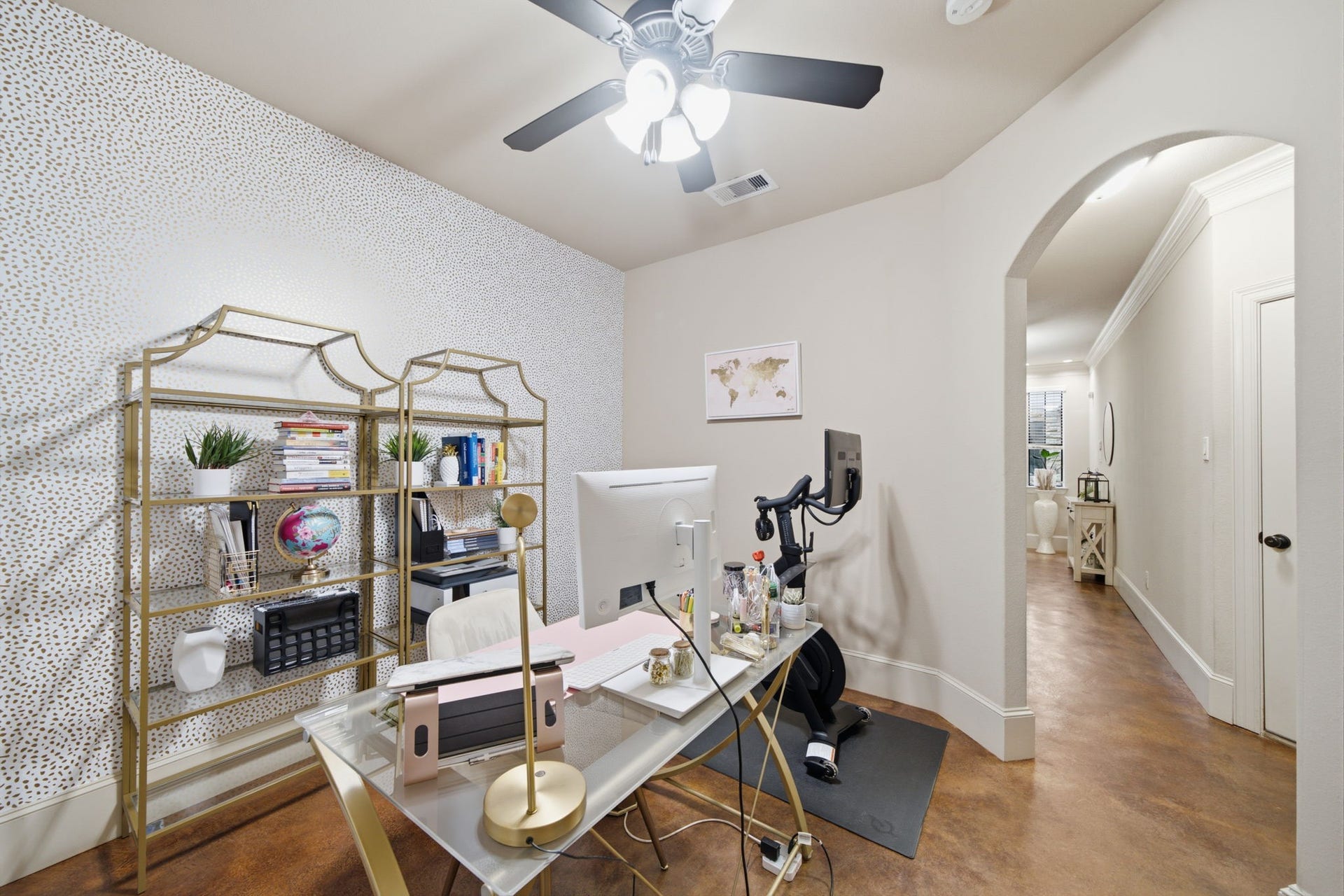 Glamorous home office/flex room with graceful arched entry.  The generous sized closet under the stairs could open to this room if a 4th bedroom is desired.