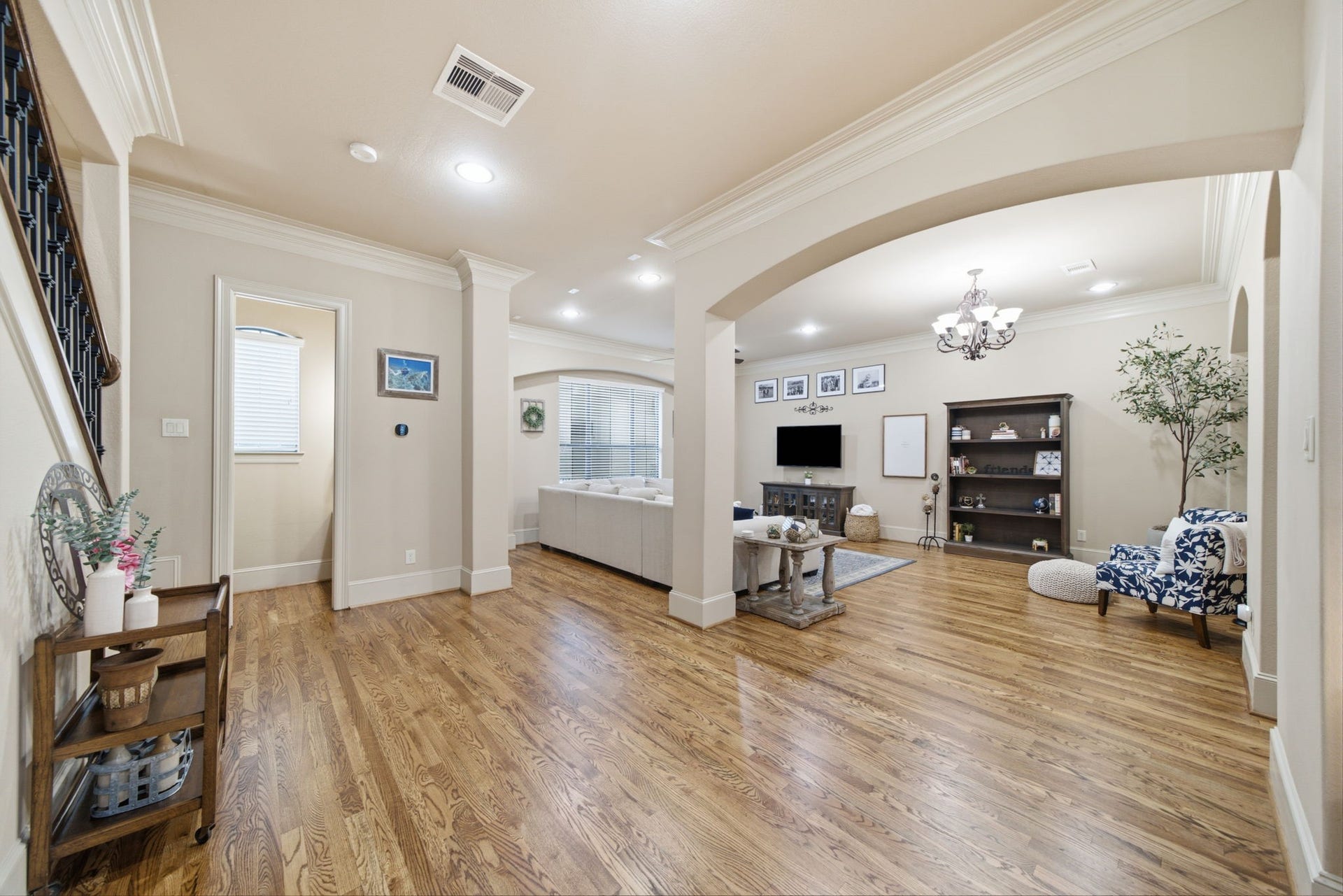 The living level has new hardwood floors with graceful arches and recessed lighting.