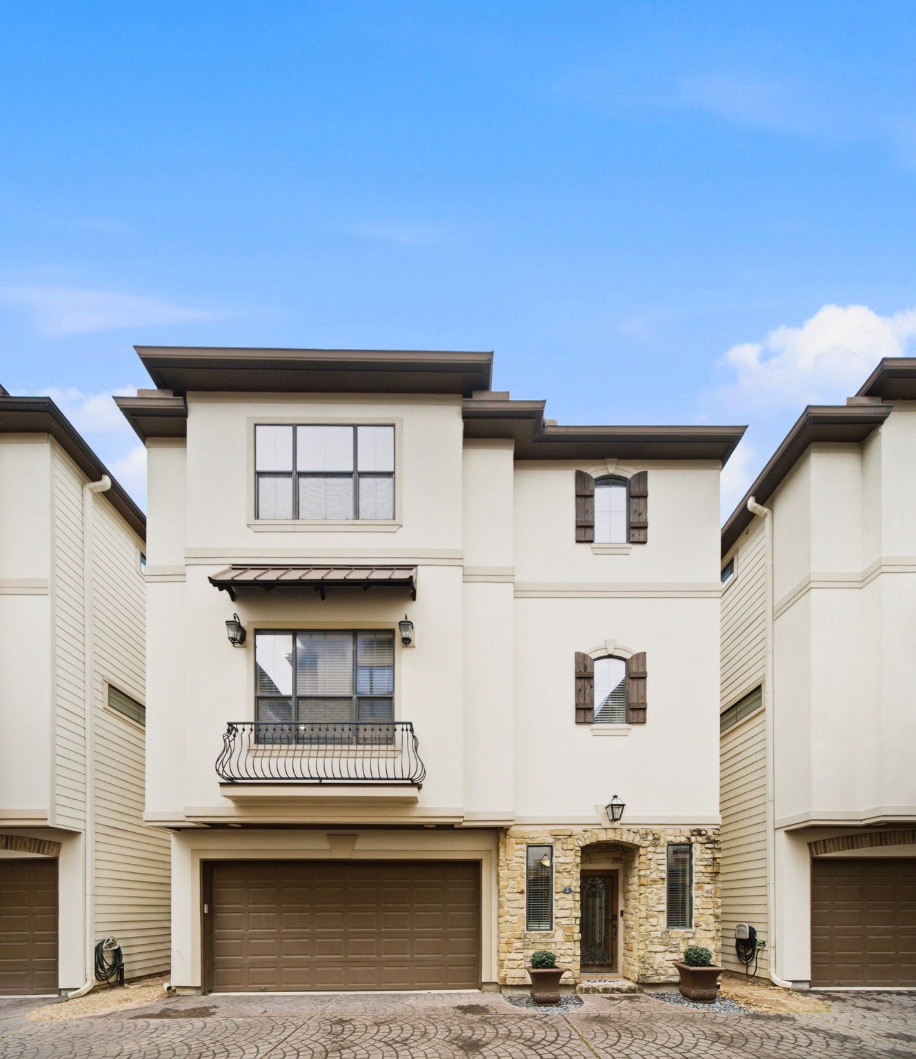 Welcome home to this lovely free standing home in a GATED enclave with no HOA!